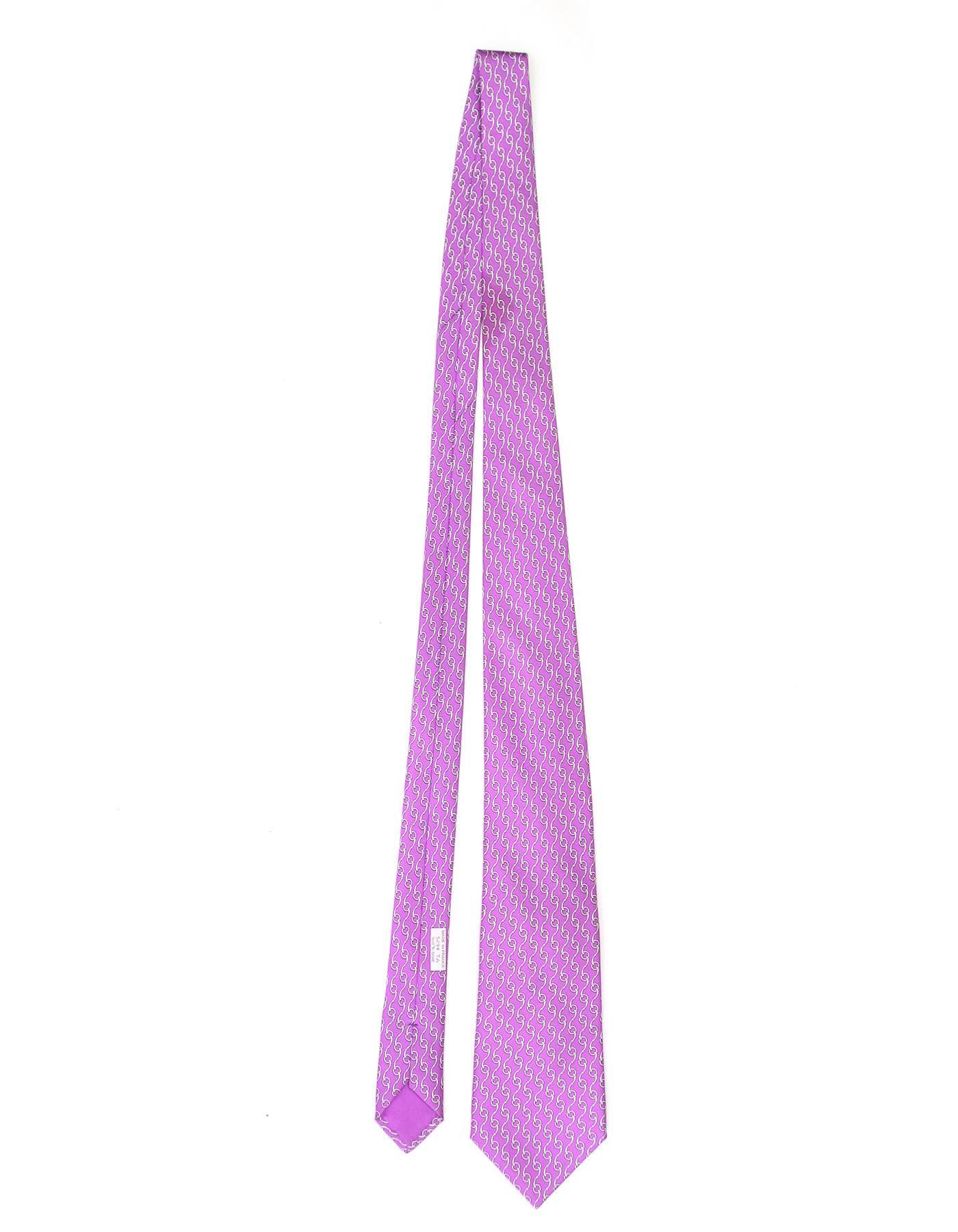 Hermes Purple & White Chain Print Silk Tie

Made In: France
Color: Purple and white
Composition: 100% silk
Retail Price: $180 + tax
Overall Condition: Excellent pre-owned condition with the exception of a faint stain to bottom front of tie (ref