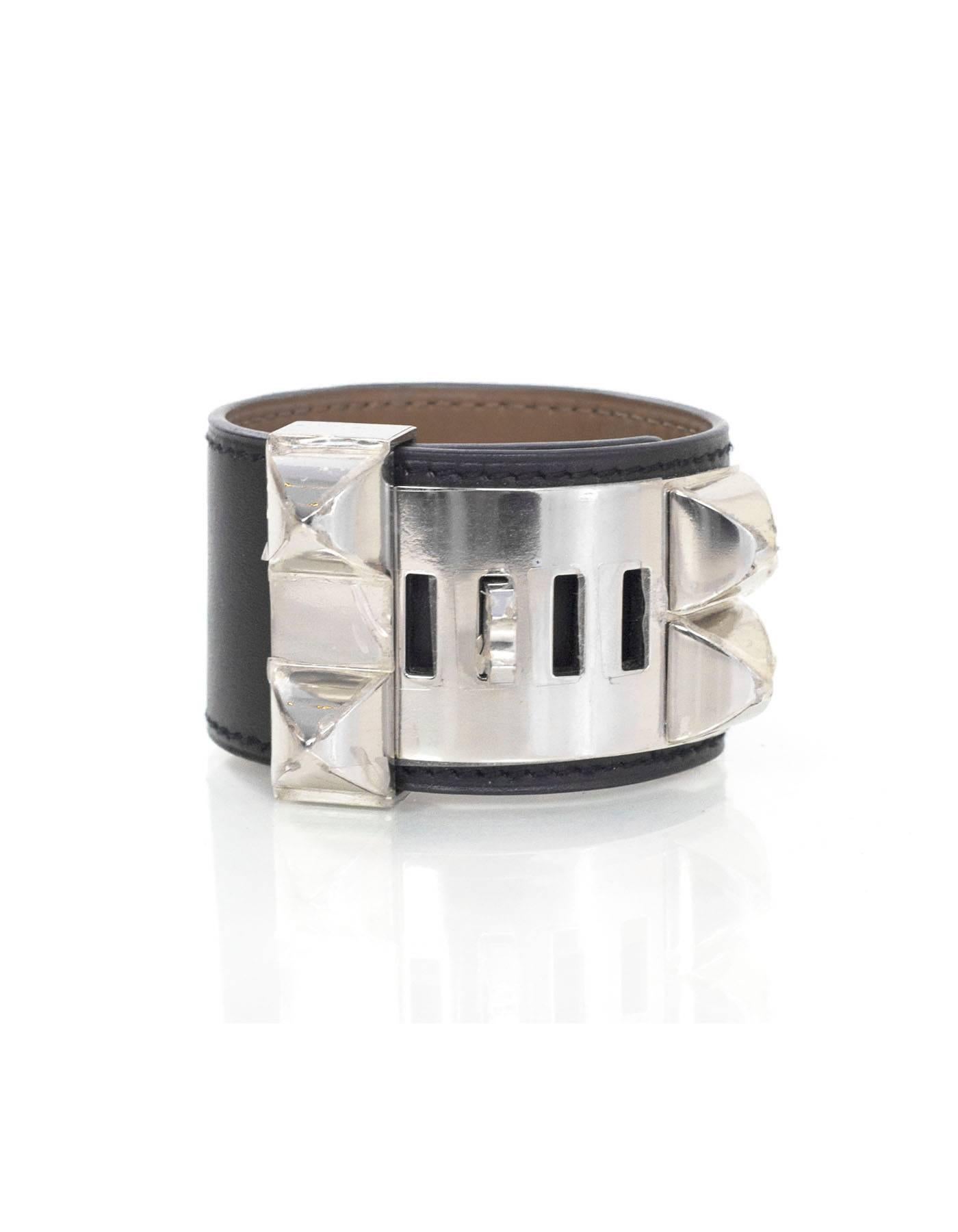 Hermes Black Leather CDC Bracelet 

Made In: France
Year of Production: 2013
Color: Black
Hardware: Palladium
Materials: Leather
Closure: Sliding stud and notch closure
Stamp: Q stamp in square
Retail Price: $1,150 + tax
Overall Condition: