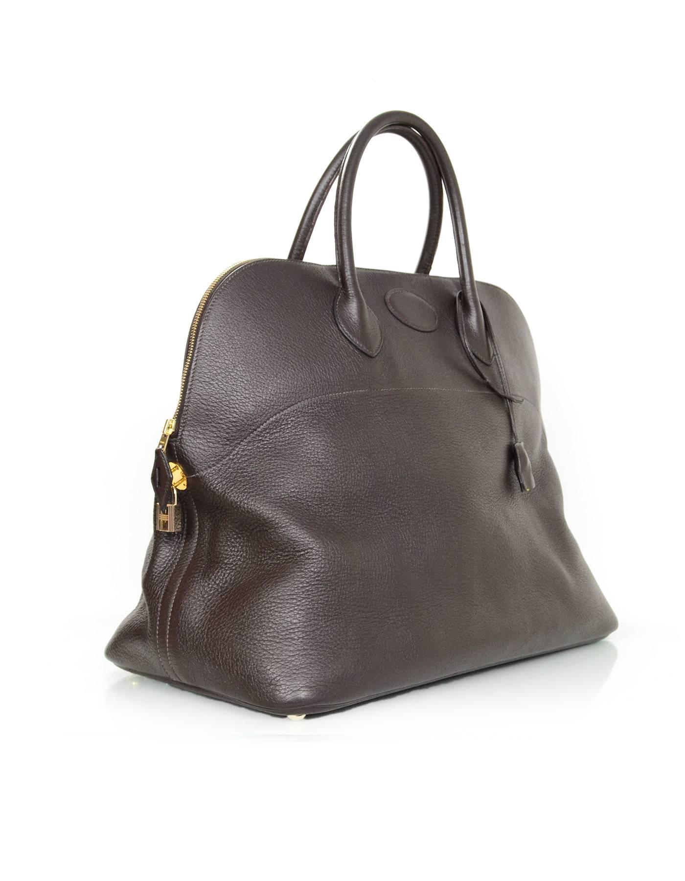 Hermes Brown Clemence 45cm Travel Bolide Bag 

Made In: France
Year of Production: 2004
Color: Brown
Hardware: Goldtone
Materials: Leather
Lining: Brown leather and tan canvas
Closure/Opening: Zip around top
Exterior Pockets: None
Interior Pockets: