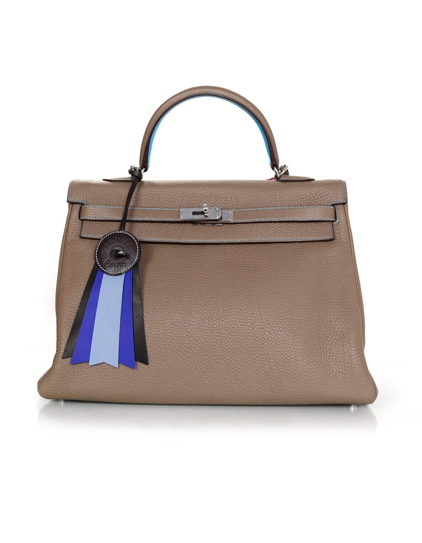 Hermes Black/Brown/Blue Paddock Flot Ribbon Bag Charm NIB

Made In: France
Color: Black, brown, blue
Materials: Cowhide, milo lambskin leather
Stamp: Hermes Paris Made in France
Overall Condition: Excellent pre-owned condition - NIB
Includes: Hermes