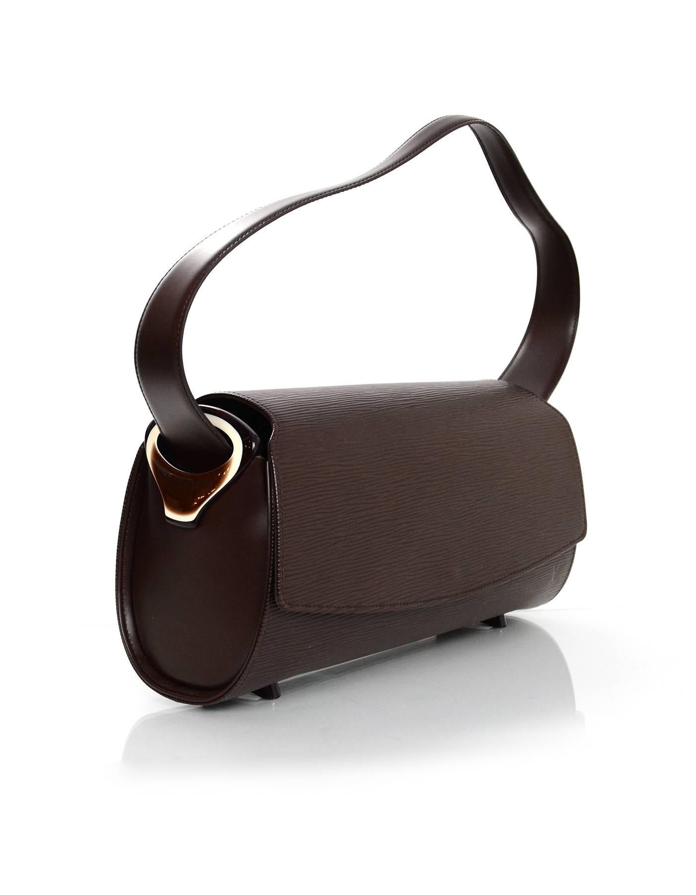 Louis Vuitton Epi Moka Nocturne Shoulder Bag
Features resin details on side panels of bag

Made In: France
Year of Production: 2001
Color: Brown 
Hardware: Goldtone
Materials: Epi leather and smooth leather
Lining: Brown micro fiber
Closure/Opening: