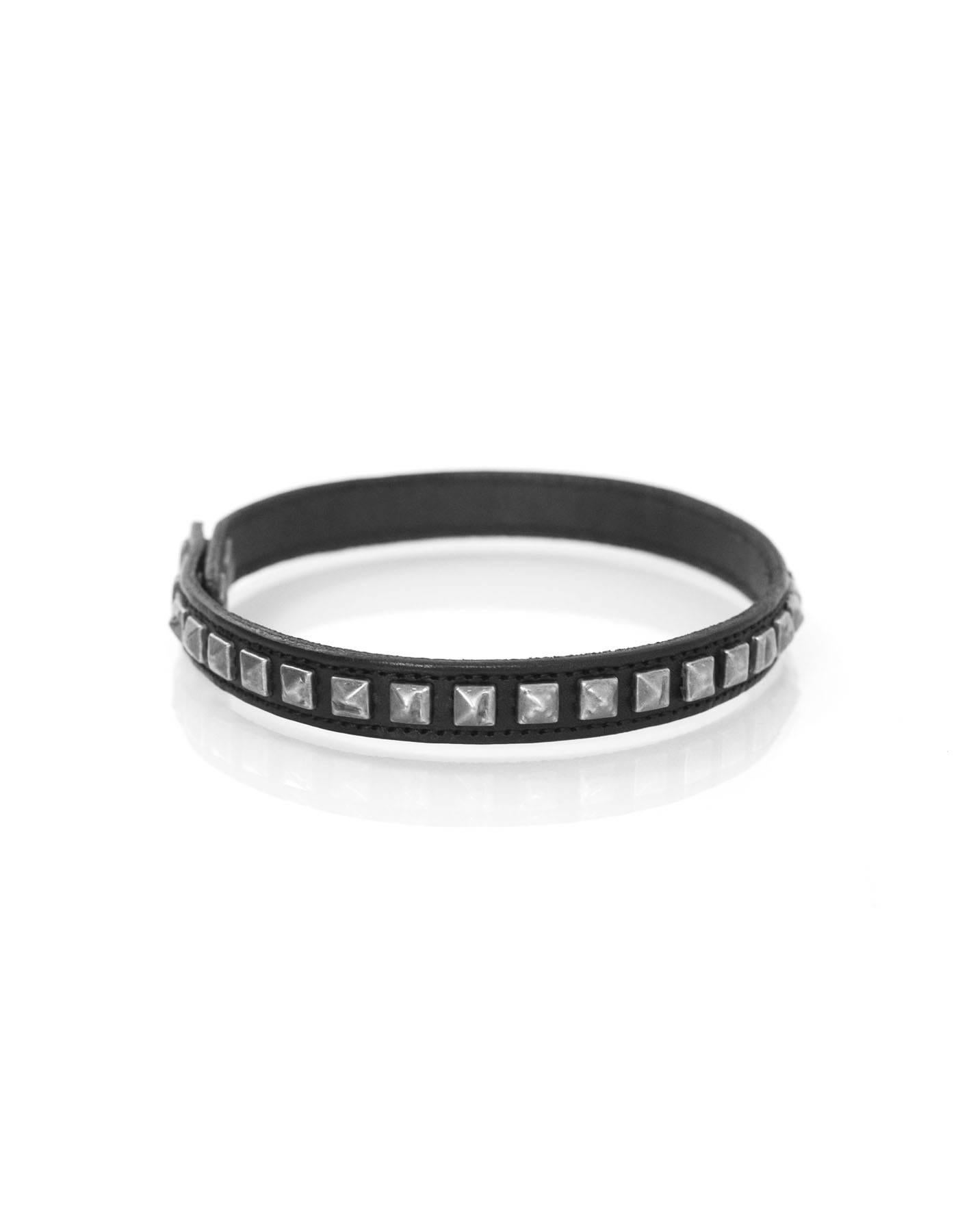 Saint Laurent NEW Black Leather Studded Choker

Made In: Italy
Year of Production: 2015
Color: Black
Hardware: Oxidized silvertone
Materials: Leather and metal
Closure/Opening: Double snap closure
Stamp: GBL403593.0715
Retail Price: $295 +