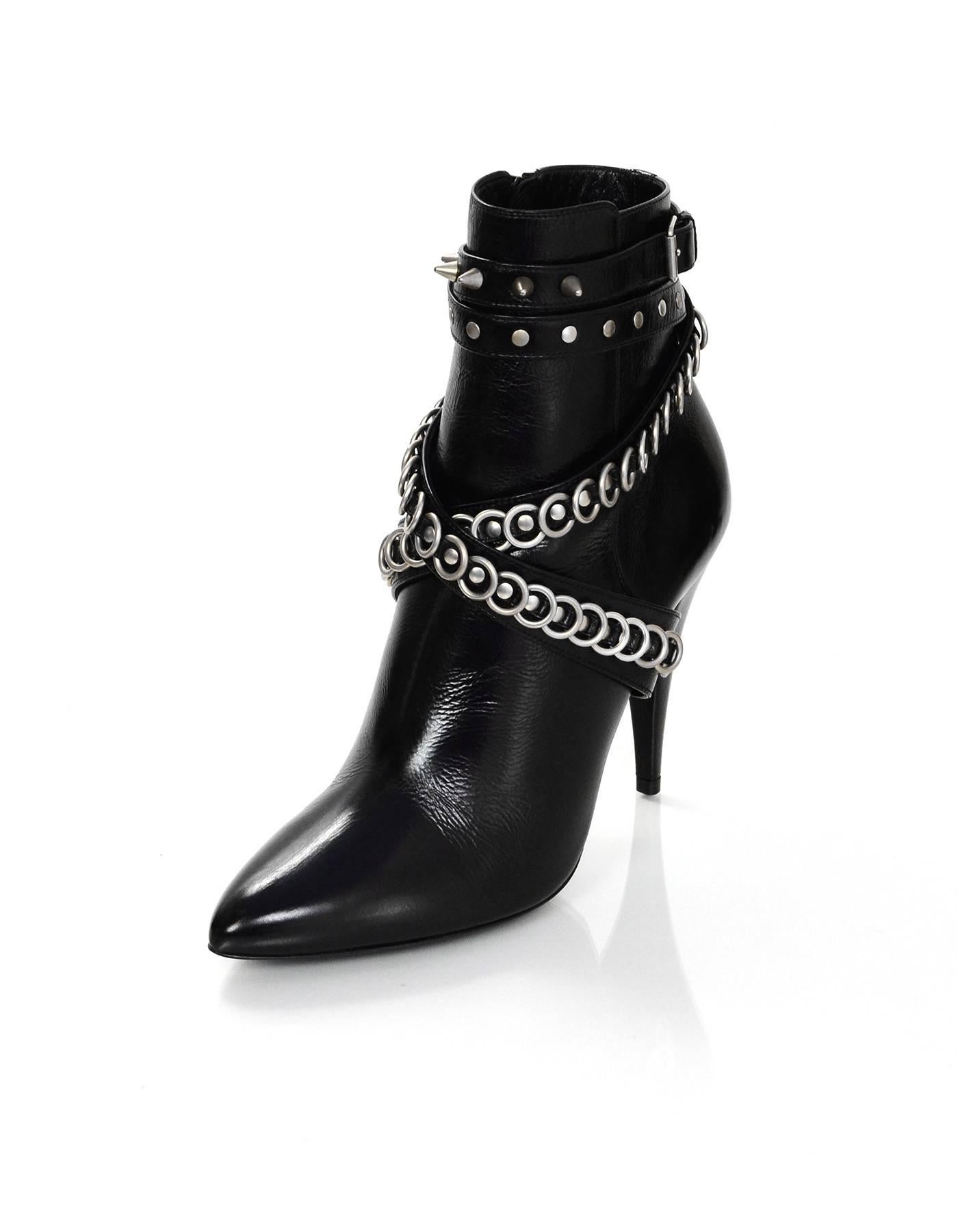 Saint Laurent Black Leather Multi-trap Studded Fetish 105 Booties 
Features metal loops and studs throughout

Made In: Italy
Color: Black and silvertone
Materials: Leather and metal
Closure/Opening: Side ankle zipper
Sole Stamp: Saint Laurent Paris