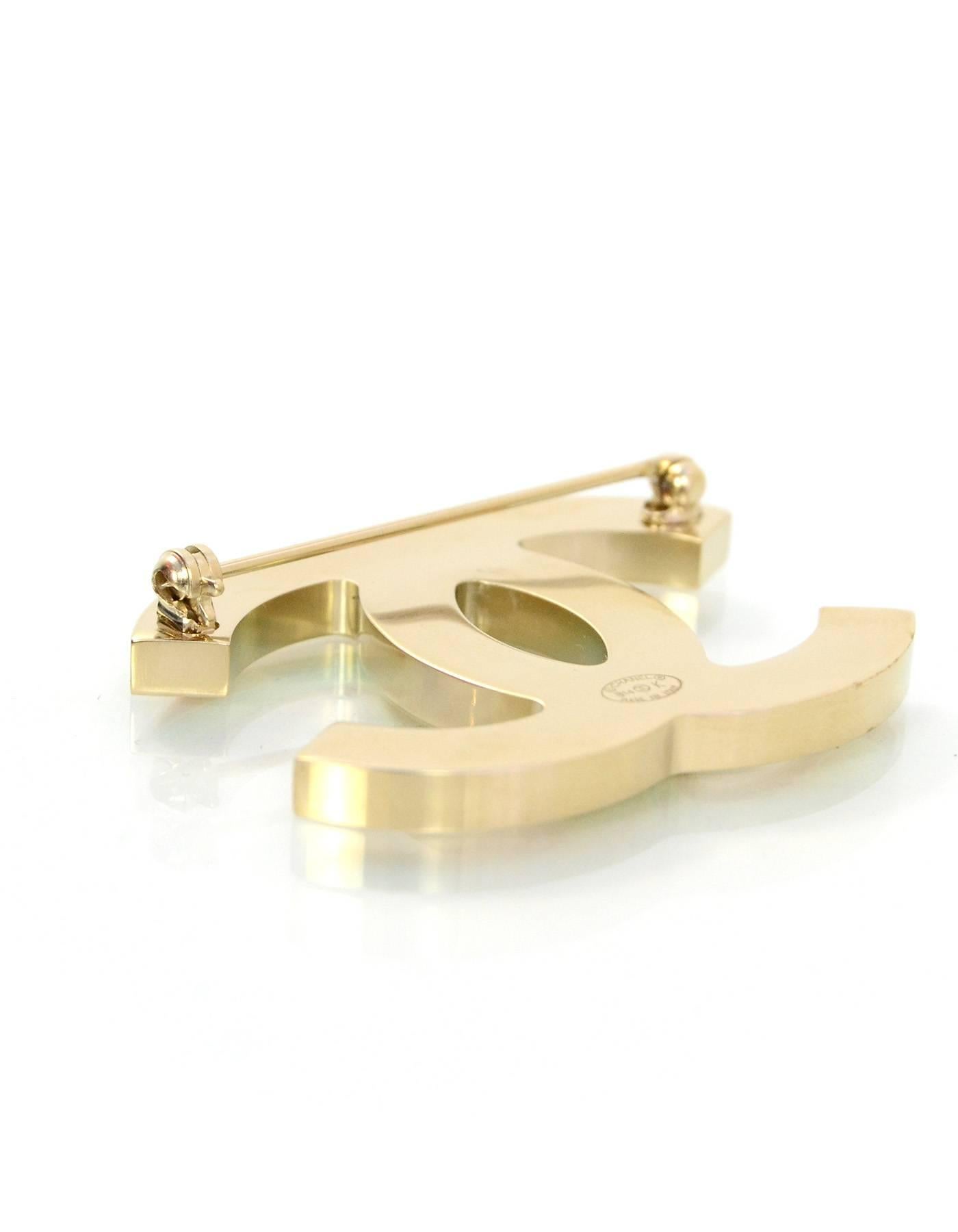 Chanel Iridescent CC Brooch Pin 
Features iridescent leather center

Made In: Italy
Year of Production: 2014
Color: Multi-colored iridescent
Hardware: Light goldtone
Materials: Leather and metal
Closure: Pin back closure
Stamp: B14 CC K
Overall