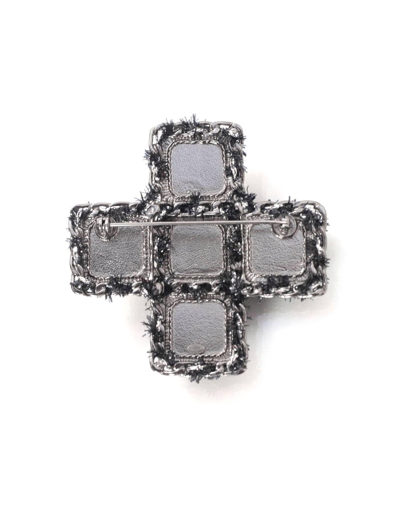 Chanel Black Velvet Cross Brooch Pin 
Features center ruthenium CC

Made In: France
Year of Production: 2013
Color: Black
Hardware: Ruthenium
Materials: Velvet and metal 
Closure: Pin back closure
Stamp: A13 CC K
Overall Condition: Excellent