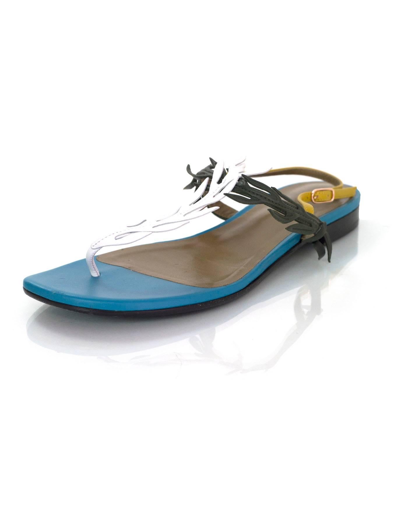 Hermes '16 Multi-Colored Leather Myrthe Sandals
Features leaf-like details to straps

Made In: Italy
Color: Teal, army green, white and mustard yellow
Materials: Leather
Closure/Opening: Ankle strap with buckle and notch closure
Sole Stamp: Hermes