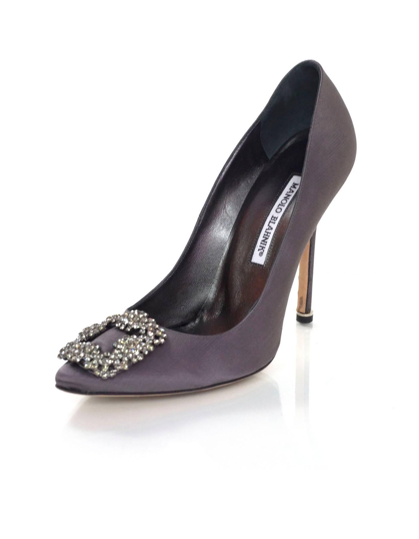 Manolo Blahnik Grey Satin Hangisi Pumps Sz 38.5

Made In: Italy
Color: Grey
Materials: Satin, crystal
Closure/Opening: Slide on
Sole Stamp: Made in Italy 38 1/2 Manolo Blahnik 
Retail Price: $965 + tax
Overall Condition: Excellent pre-owned