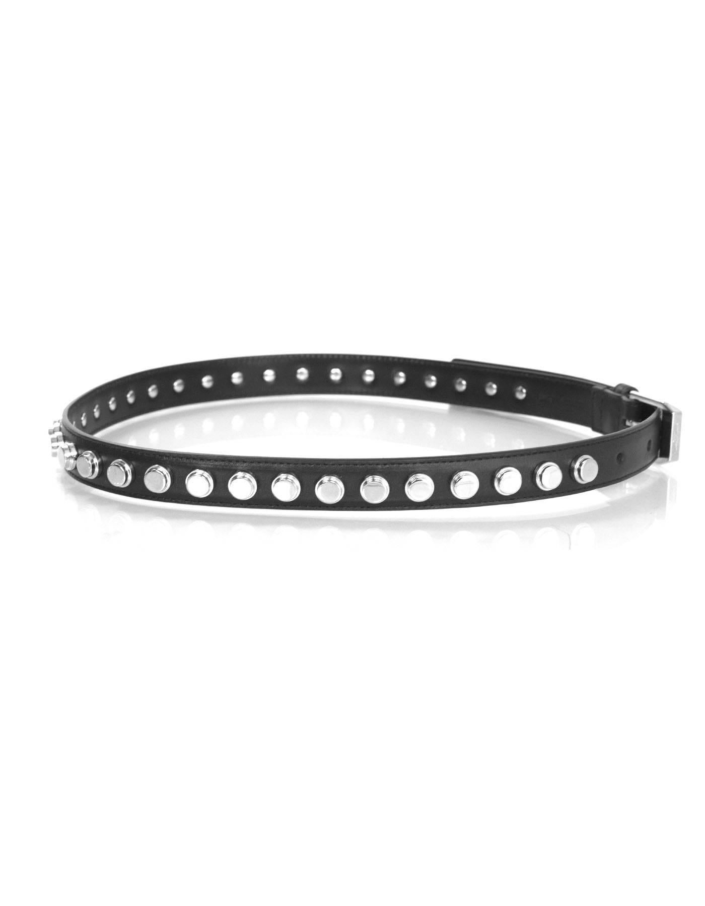 Saint Laurent Black & Silvertone Studded Belt 

Made In: Italy
Color: Black
Hardware: Silvertone
Materials: Leather and metal
Closure/Opening: Buckle and notch closure
Stamp: 314552.212956.70.28
Retail Price: $895 + tax
Overall Condition:
