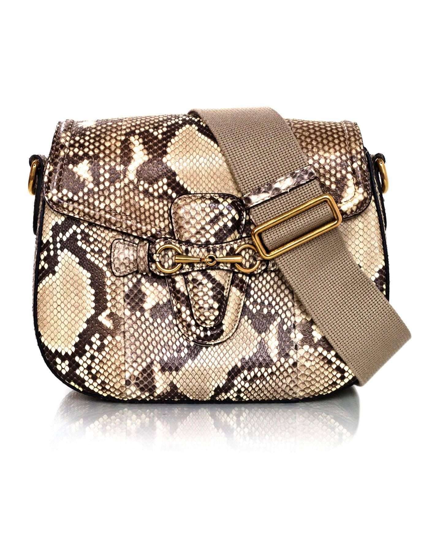 Gucci Python Lady Web Crossbody Bag
Features optional all python or canvas straps

Made In: Italy
Color: Cream and taupe
Hardware: Goldtone
Materials: Python and metal
Lining: Cream leather
Closure/Opening: Flap top with push-tab closure
Exterior