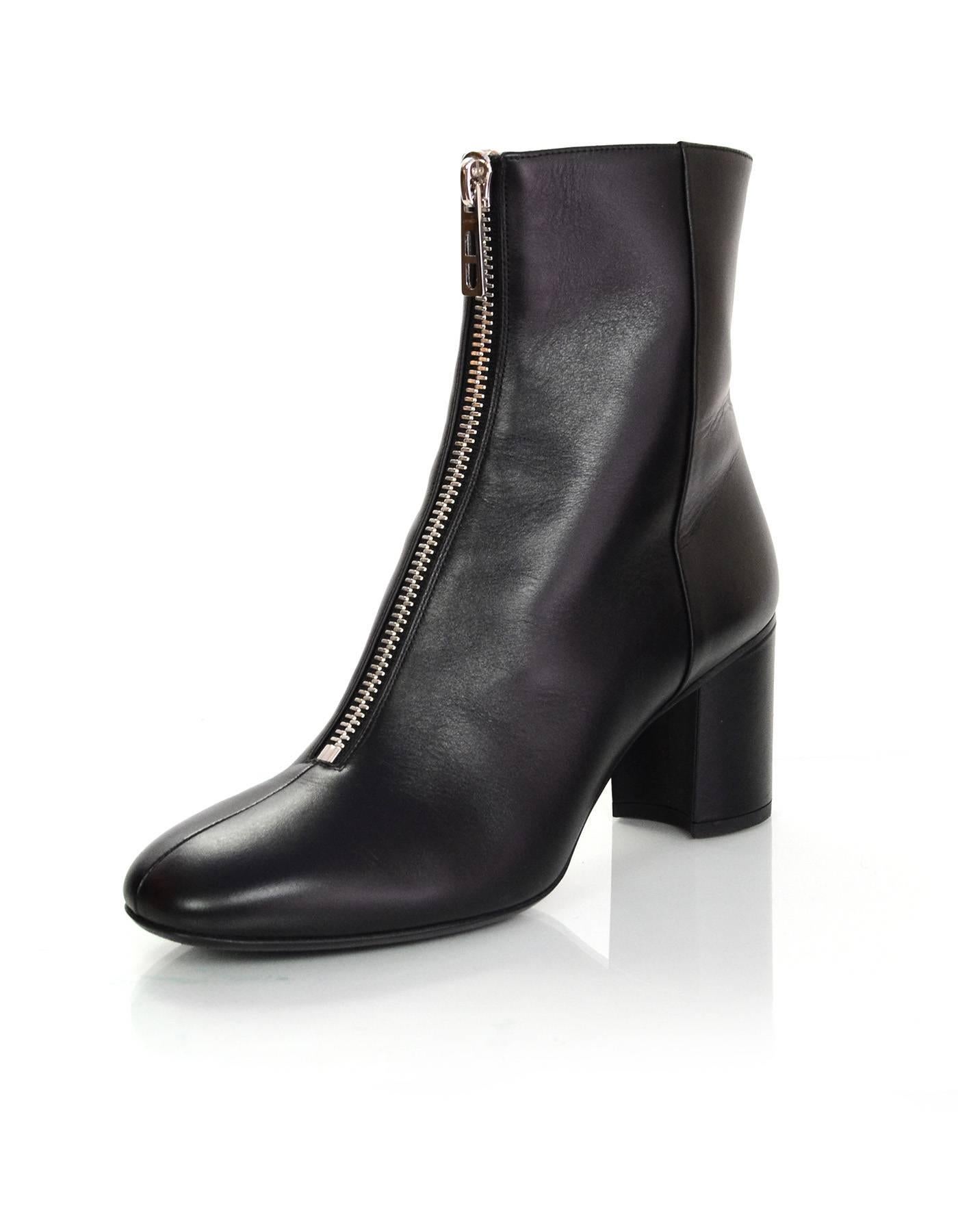 Hermes Black Leather New York 70 Zipper Ankle Boots Sz 38.5
Features front zipper with chain d'ancre zipper pull 

Made In: Italy
Color: Black
Materials: Leather
Closure/Opening: Zip closure at front
Sole Stamp: Hermes 38 1/2 Made in Italy
Retail