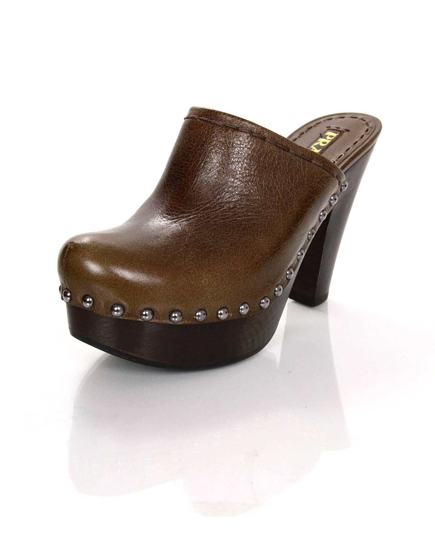 Prada Brown Leather Clogs Sz 36.5

Made In: Italy
Color: Brown
Materials: Leather
Closure/opening: Slide on
Sole Stamp: Prada 36.5
Overall Condition: Excellent pre-owned condition with the exception of light wear at insoles and out soles
Included: