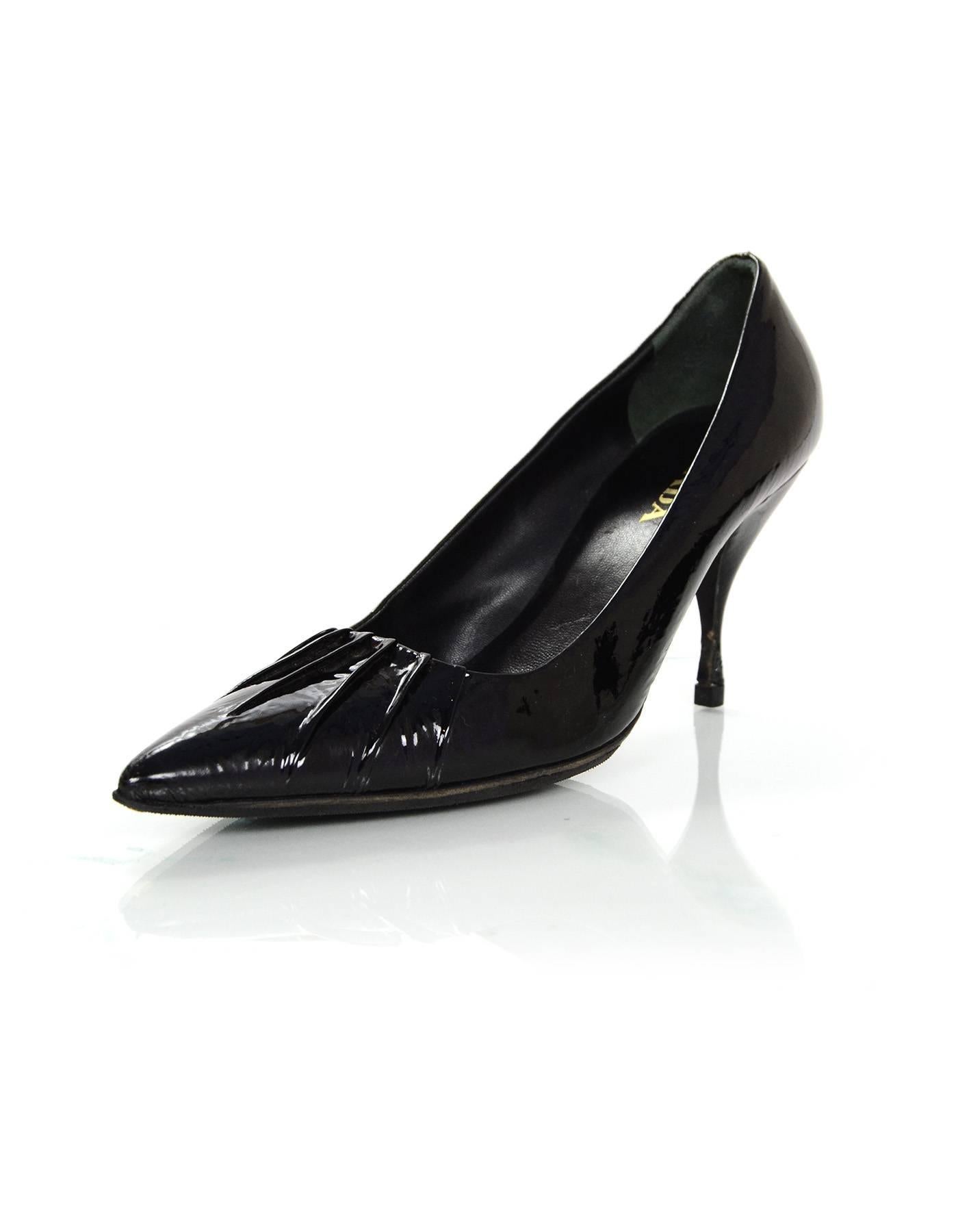 Prada Black Patent Pumps Sz 36.5

Made In: Italy
Color: Black
Materials: Patent leather
Closure/opening: Slide on
Sole Stamp: Prada Made in Italy 36.5 vero cuoio
Overall Condition: Very good pre-owned condition with the exception of wear at patent