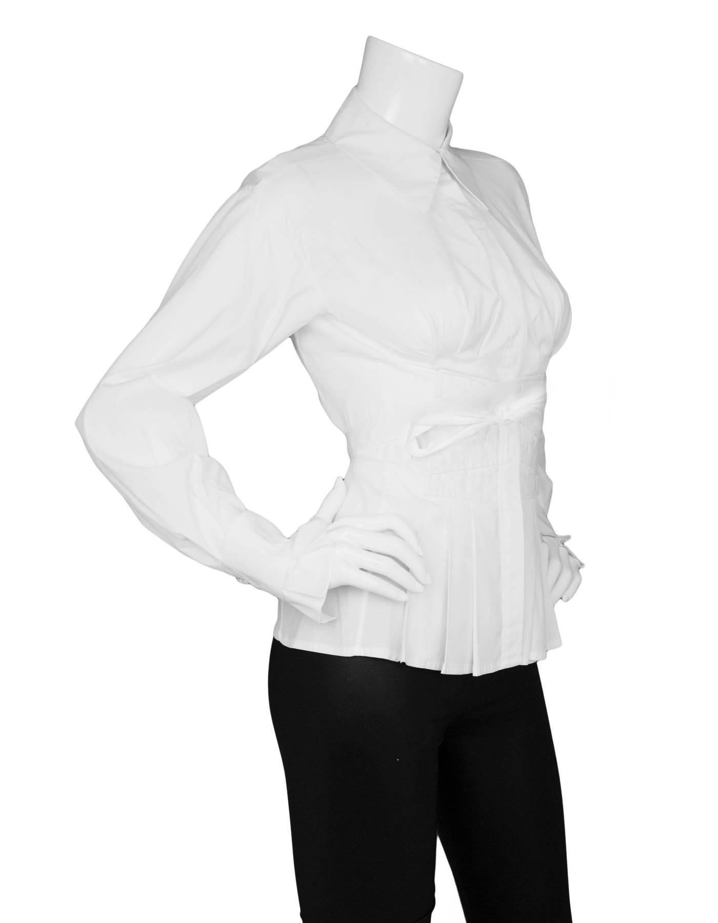 Yves Saint Laurent White Cotton Button Down Top 
Features pleating and faux corset tie in front

Made In: Italy
Color: White
Composition: 75% cotton, 21% nylon, 4% spandex
Lining: None
Closure/Opening: Button down front
Exterior Pockets: