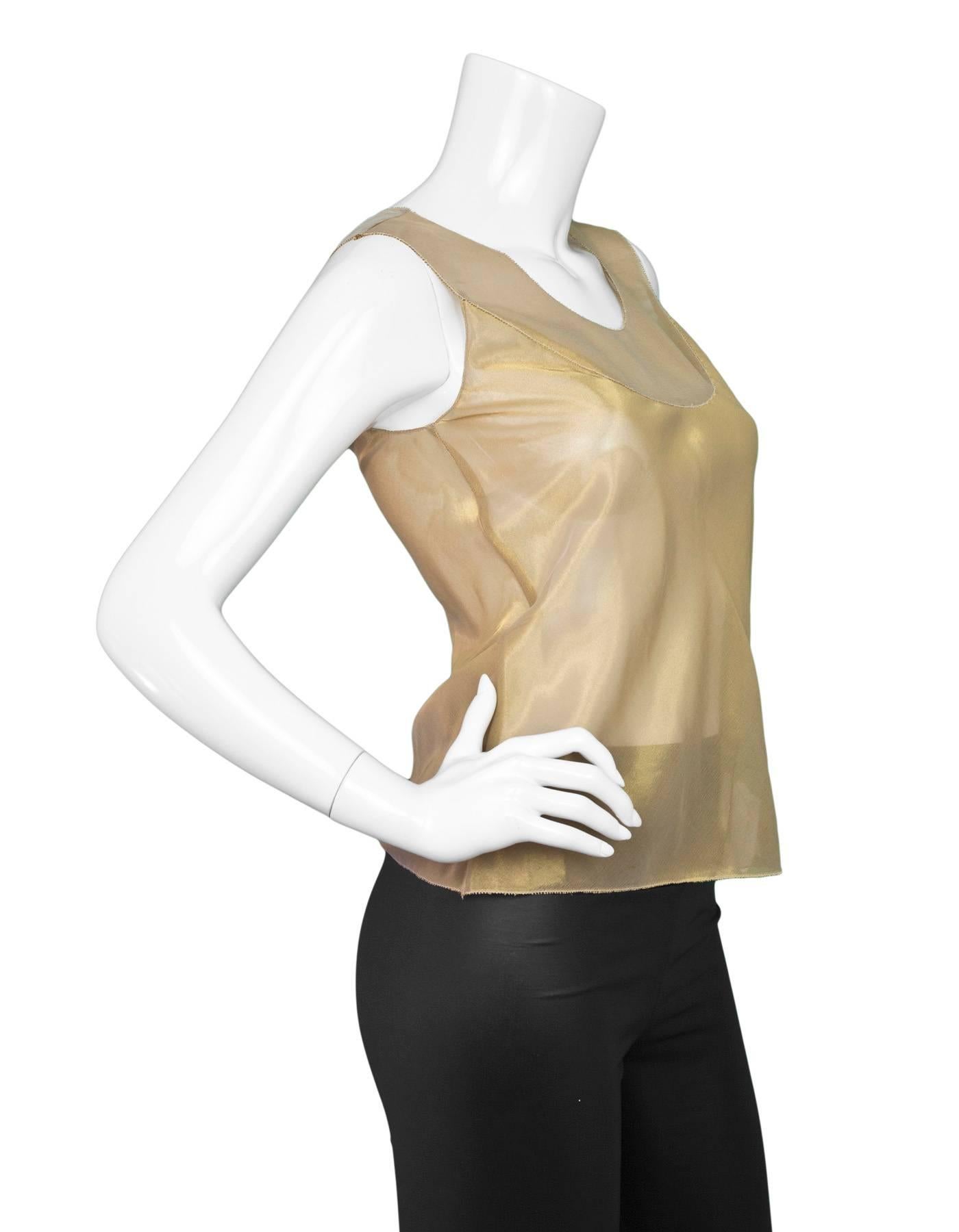 Vera Wang Metallic Gold Sleeveless Top 

Color: Metallic gold
Composition: Not given- believed to be a silk blend
Lining: None
Closure/Opening: Pull over
Exterior Pockets: None
Interior Pockets: None
Overall Condition: Excellent pre-owned condition