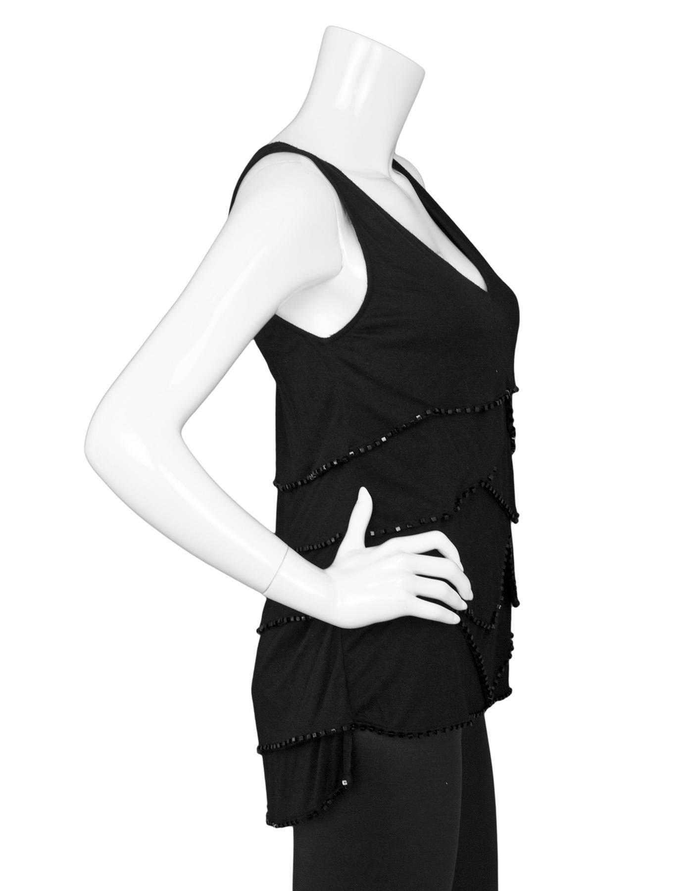 Givenchy Black Sleeveless Beaded Tiered Top 
Features beading throughout each tier 

Color: Black
Composition: Not given- believed to be a cotton-blend
Lining: None
Closure/Opening: Pull over
Exterior Pockets: None
Interior Pockets: None
Overall