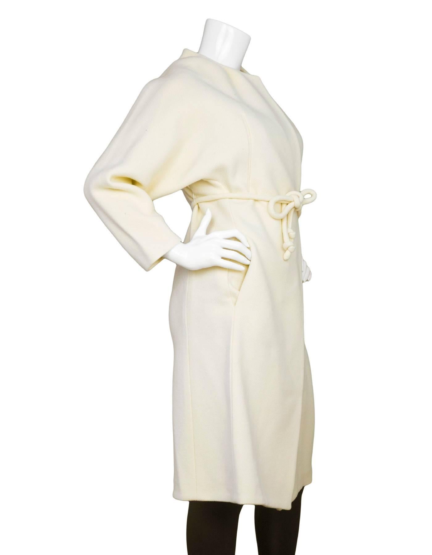 Chloe Cream Wool Long Belted Coat sz FR36
Features matching waist tie and interior draw string for cinching waist
Made In: France
Color: Cream
Composition: 80% Virgin wool, 20% polyamide
Lining: 100% Viscose
Closure/Opening: One front waist snap