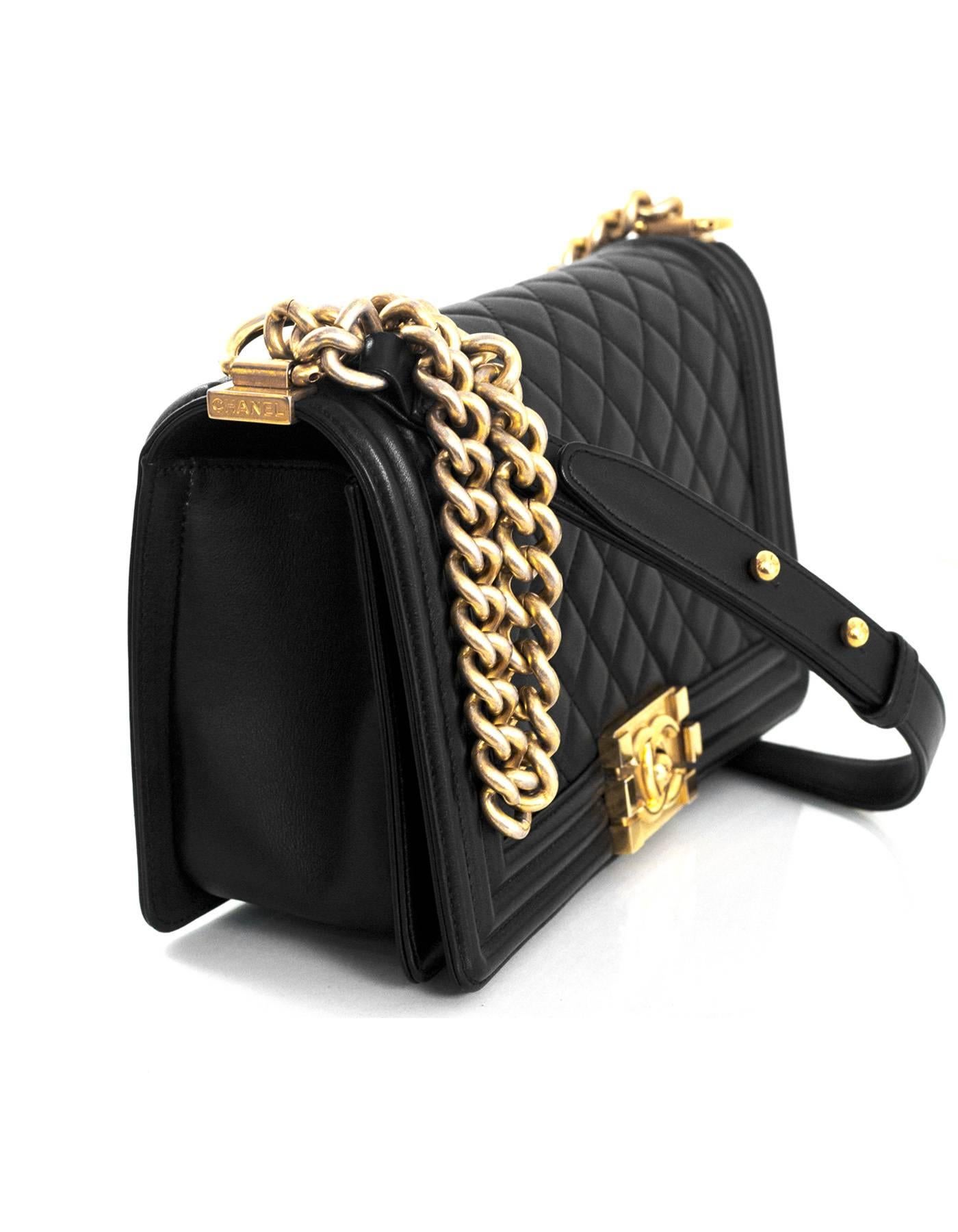 Chanel Black Lambskin Old Medium Boy Bag with GHW

Made In: France
Year of Production: 2014-2015
Color: Black, Gold
Hardware: Goldtone
Materials: Lambskin leather, metal
Lining: Black grossgrain
Closure/Opening: Flap top with CC push lock