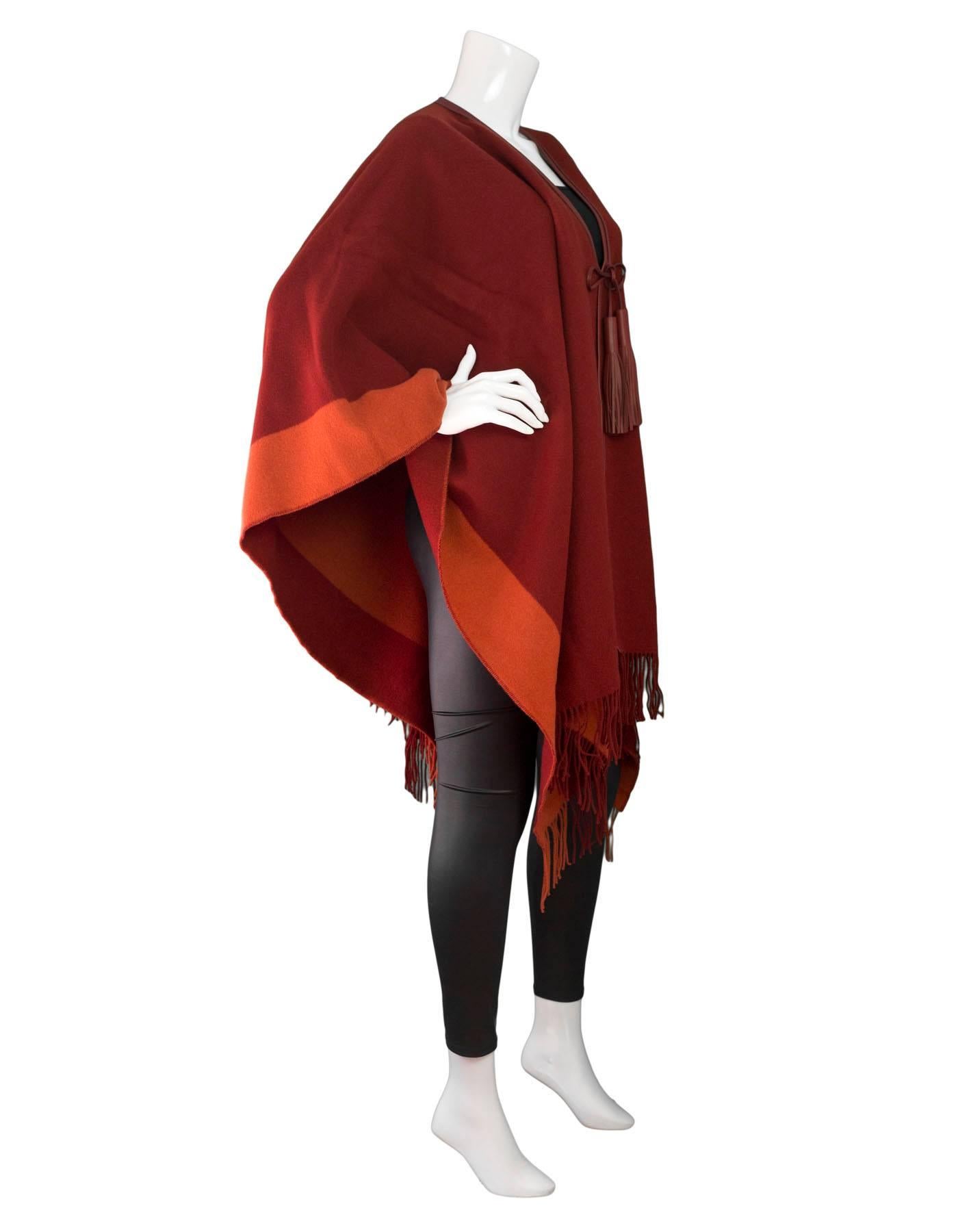 Hermes Burgundy Wool Rocabar Poncho
Features leather trim and tassels

Made In: France
Color: Burgundy
Composition: 90% Wool, 10% Cashmere
Retail Price: $1,325 + tax
Overall Condition: Excellent pre-owned condition 
Included: Hermes