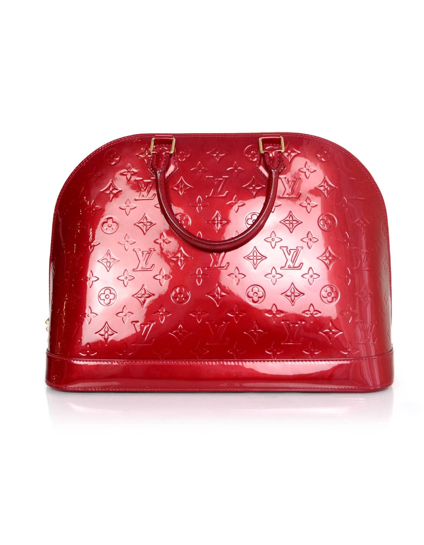 Louis Vuitton Pomme d'Amour Red Monogram Vernis Alma GM

Made In: France
Year of Production: 2010
Color: Pomme d'Amour Red
Hardware: Goldtone
Materials: Vernis leather (patent leather)
Lining: Red canvas
Closure/Opening: Double zip around