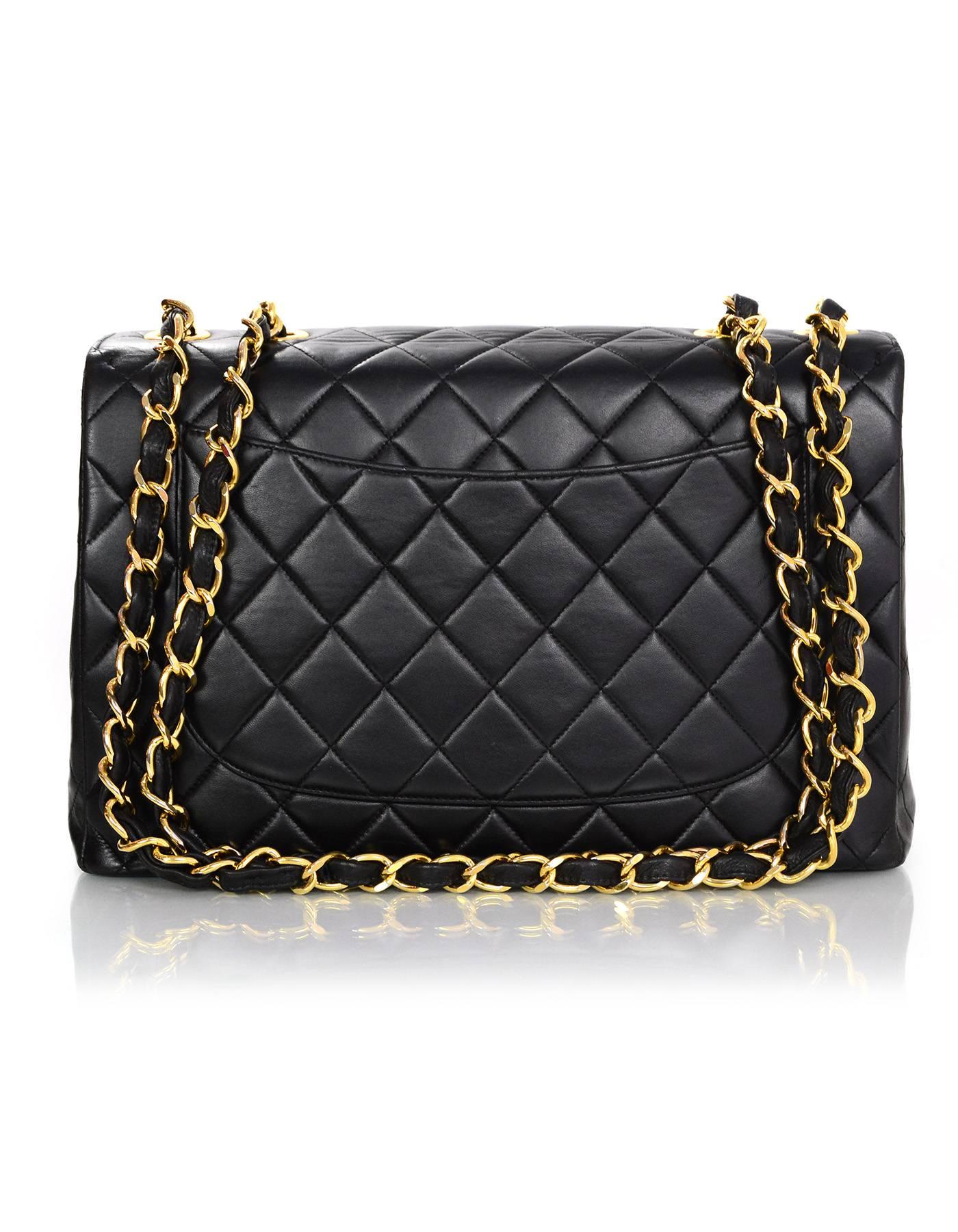 Chanel Black Quilted Classic Jumbo Flap Bag

Made In: France
Year of Production: 2000-2002
Color: Black
Hardware: Goldtone
Materials: Lambskin
Lining: Black and burgundy leather
Closure/opening: Flap top with CC twist lock
Exterior Pockets: One back