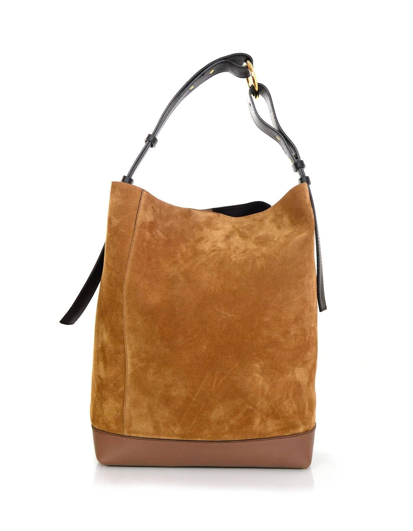 Marni NEW Tan Suede & Black Leather Halo Pod Bucket Bag
Featuers adjustable shoulder strap and detachable interior insert

Made In: Italy
Color: Black and tan
Hardware: Goldtone
Materials: Leather and suede
Lining: Black leather
Closure/Opening: