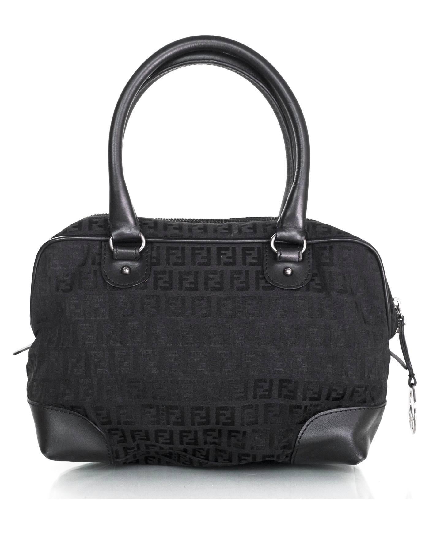 Fendi Black Canvas Zucca Print Boston Bag 
Features Fendi charm on zipper pull

Made In: Italy
Color: Black
Hardware: Silvertone
Materials: Canvas and leather
Lining: Black nylon-blend
Closure/Opening: Zip across top
Exterior Pockets: One front