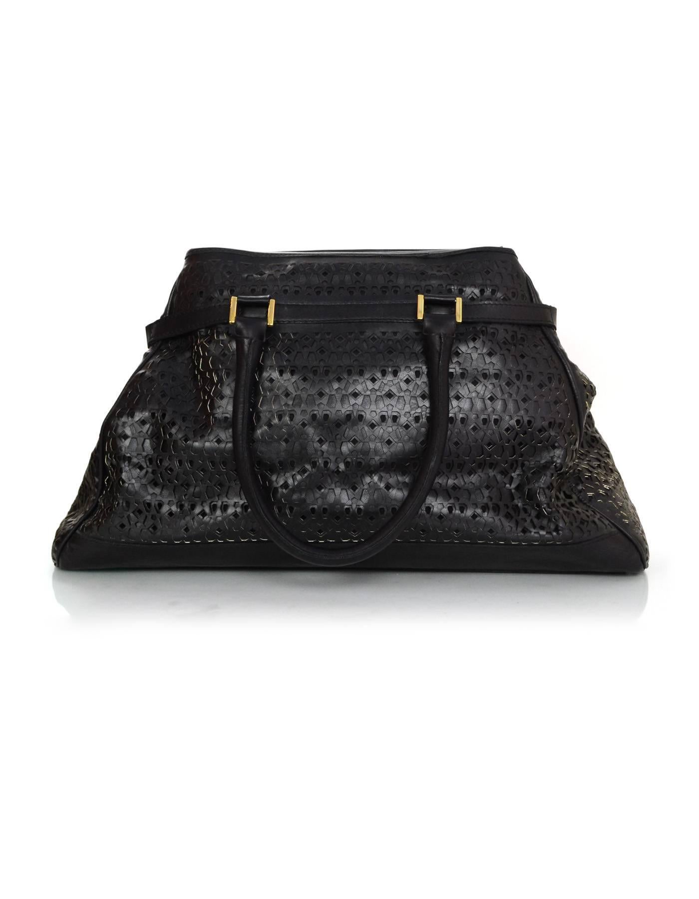 Gianfranco Ferre Black Laser Cut Leather Tote

Color: Black
Hardware: Goldtone
Materials: Leather
Lining: Black canvas
Closure/Opening: Flap top with magnetic snap closure
Exterior Pockets: One front flap pocket
Interior Pockets: One zipper