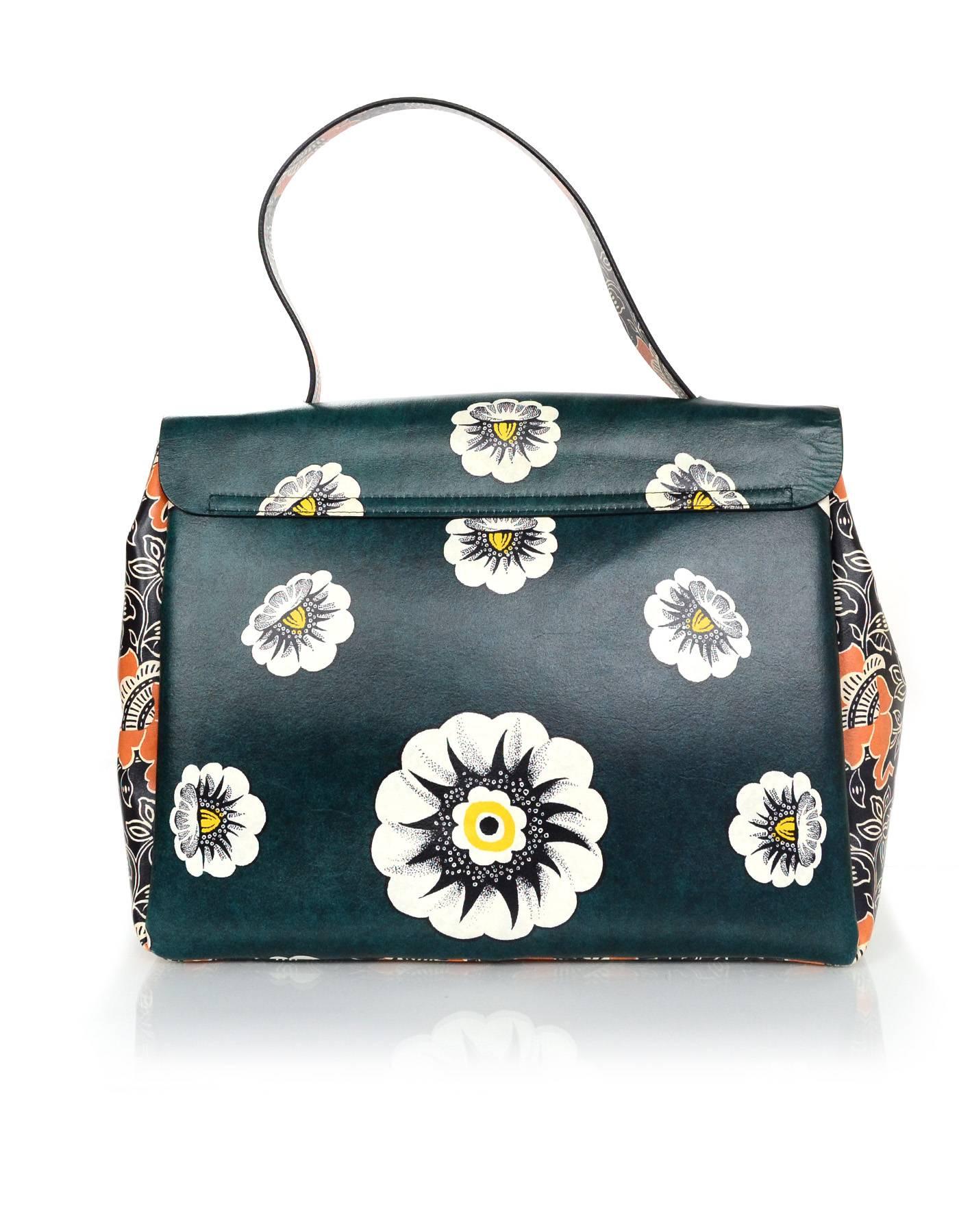 Valentino Multicolor Floral Print Mime Top Handle Bag

Made In: Italy
Year of Production: 2015
Color: Multi-colored
Hardware: Silvertone
Materials: Leather
Lining: Beige leather
Closure/Opening: Flap top with S-lock closure
Exterior Pockets: