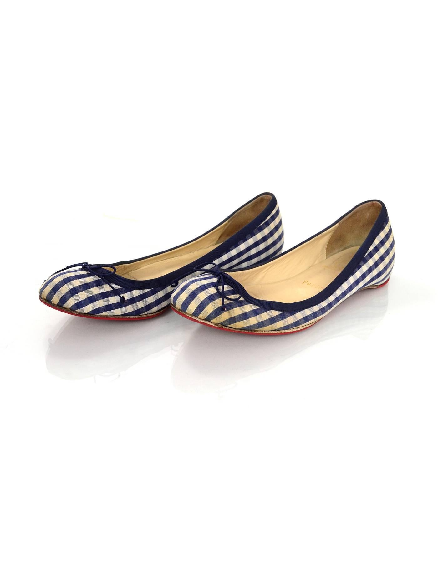 Christian Louboutin Blue & White Gingham Flats Sz 37

Made In: Italy
Color: Blue, white
Closure/Opening: Slip on
Sole Stamp: Christian Louboutin MADE IN ITALY 37
Overall Condition: Very good pre-owned condition with the exception of light