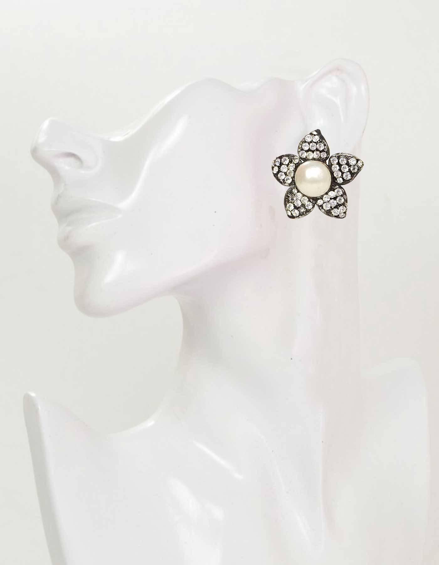 Chanel Vintage '70s Crystal & Pearl Flower Clip On Earrings 

Made In: France
Year of Production: 1970's
Color: Oxidized silvertone and ivory
Materials: Metal, faux pearl and crystal
Closure: Clip on
Stamp: Chanel CC Made in France
Overall