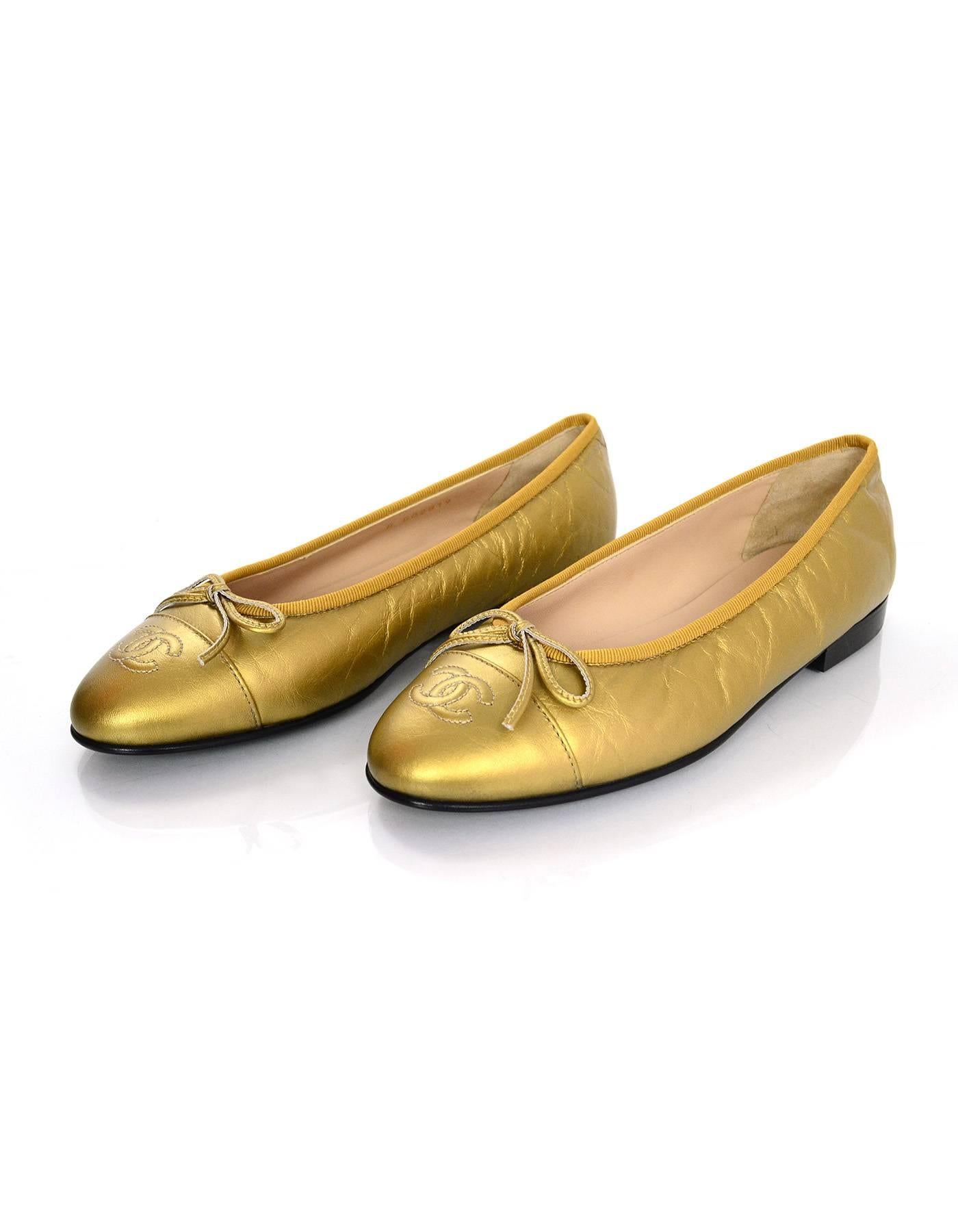 Chanel Gold Leather Ballet Flats Sz 37 NIB

Made In: Italy
Color: Gold
Materials: Leather
Closure/Opening: Slide on
Sole Stamp: CC Made in Italy 37
Retail Price: $750 + tax
Overall Condition: Excellent pre-owned condition - NIB
Included: Chanel box,