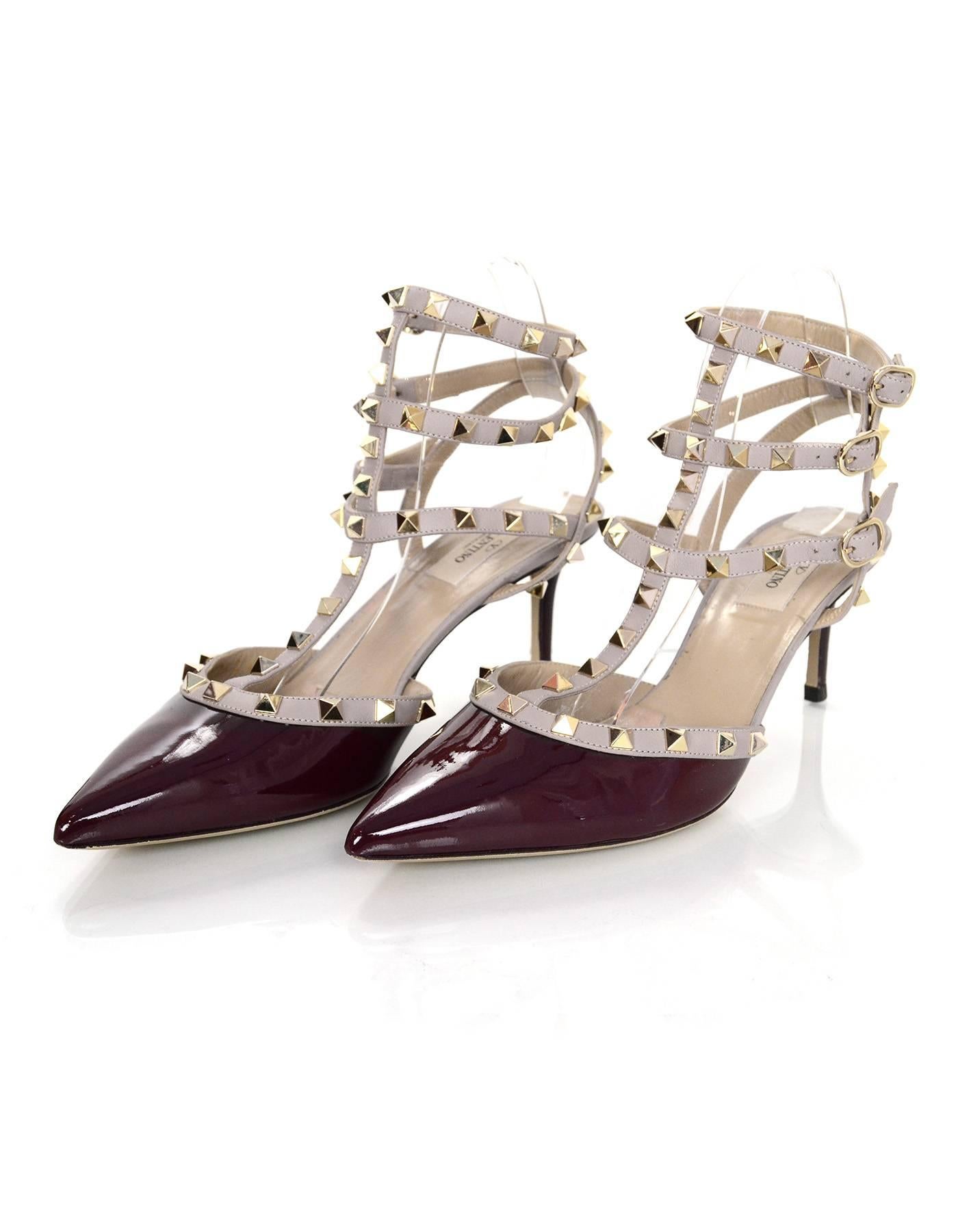 Valentino Burgundy Patent Rockstud Pumps Sz 40
65mm pumps with studding throughout

Made In: Italy
Color: Burgundy
Retail Price: $995 + tax
Materials: Patent leather, leather, metal
Closure/Opening: Buckle closure at ankle
Sole Stamp: Valentino