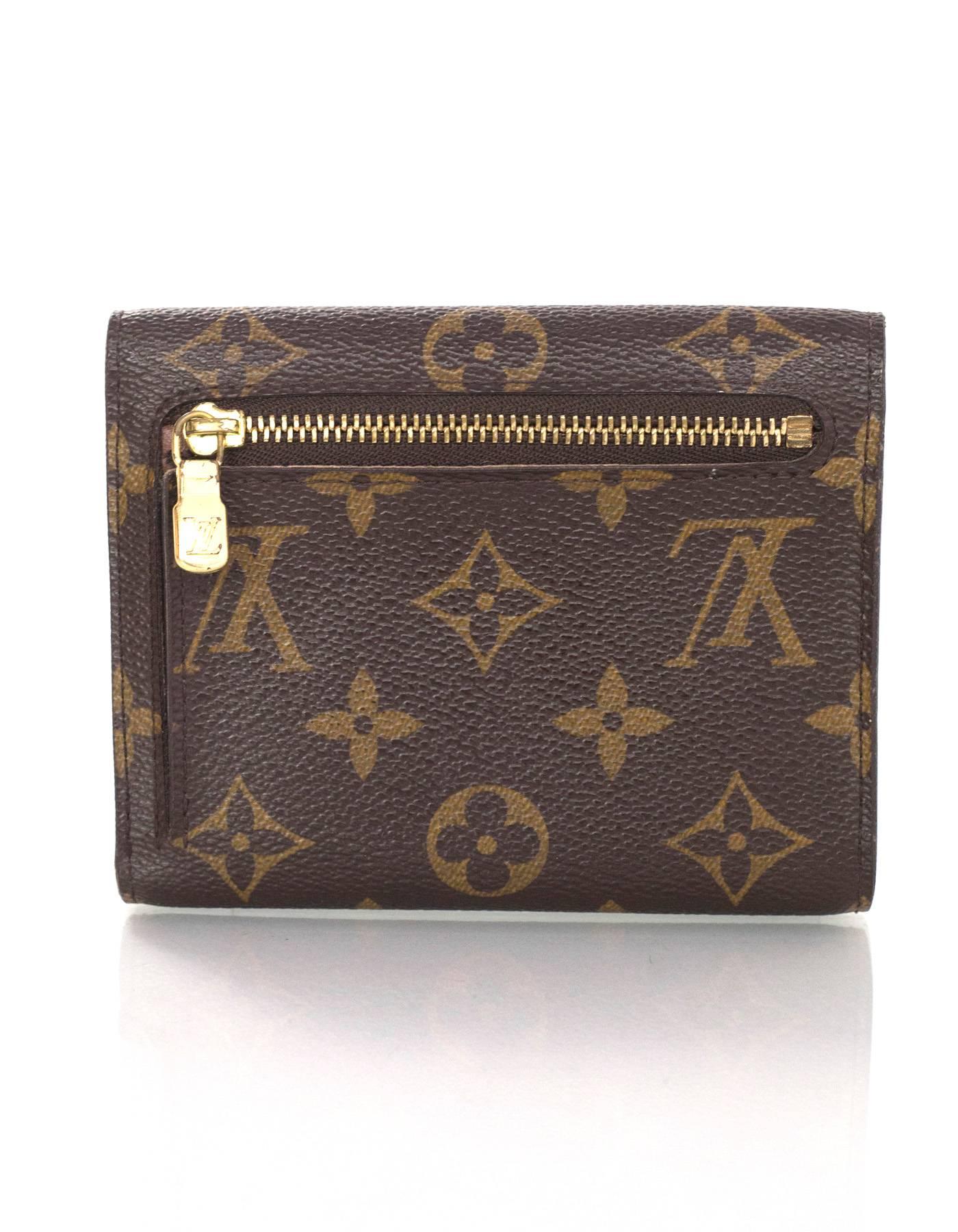 Louis Vuitton Monogram Koala Pushlock Wallet

Made In: France
Year of Production: 2007
Color: Brown and tan
Hardware: Goldtone
Materials: Coated canvas
Lining: Brown coated canvas
Closure/Opening: Bi-fold with push lock closure
Exterior Pockets: One