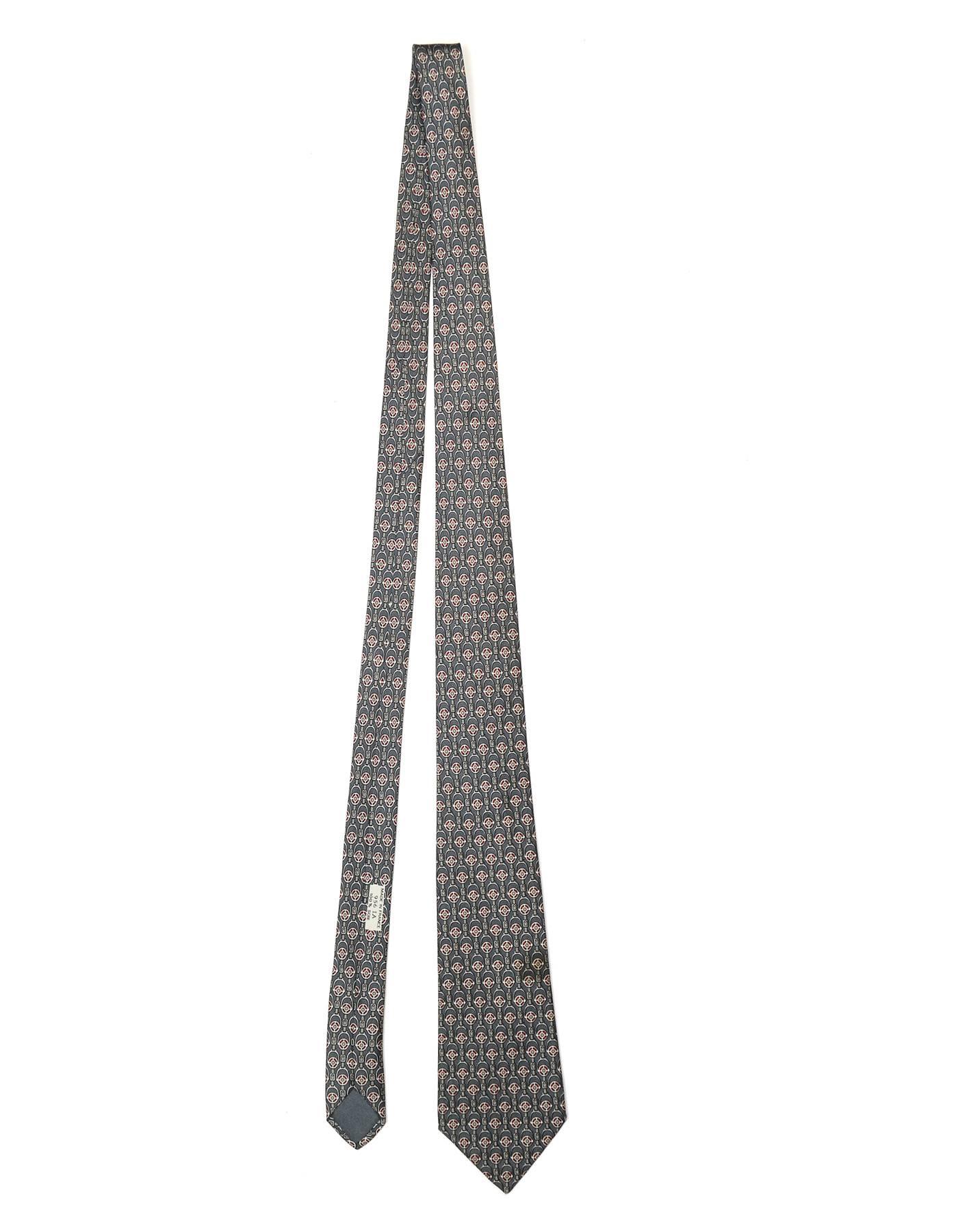 Hermes Slate Blue Stirrup Print Silk Tie

Made In: France
Color: Slate blue and red
Composition: 100% silk
Retail Price: $180 + tax
Overall Condition: Excellent pre-owned condition
Measurements: 
Length: 57.5"
Width: 1.5"-3.25"