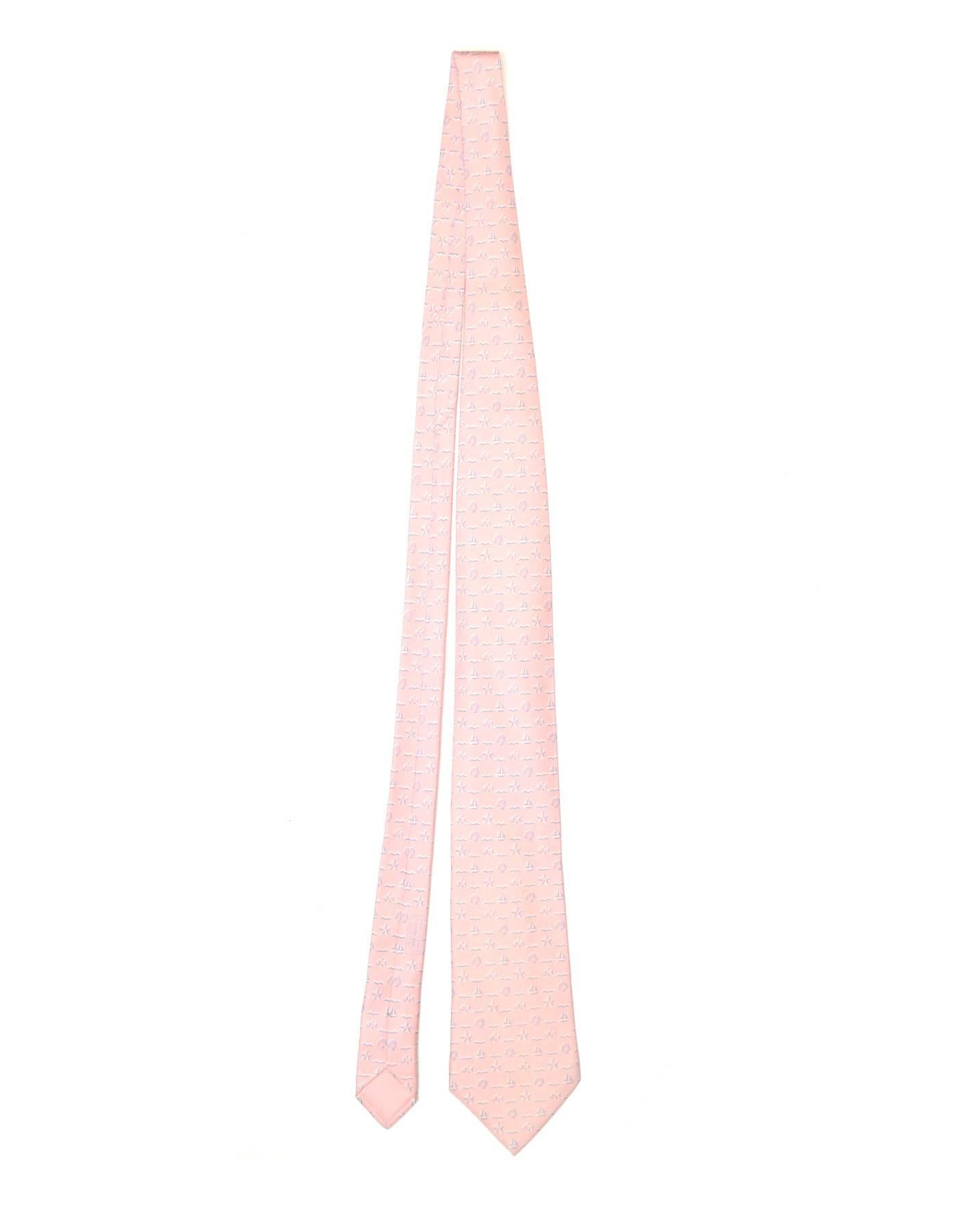Hermes Pink Sea Theme Print Silk Tie

Made In: France
Color: Pink and blue
Composition: 100% silk
Retail Price: $180 + tax
Overall Condition: Excellent pre-owned condition 
Measurements: 
Length: 62.5"
Width: 1.75"-3.75"