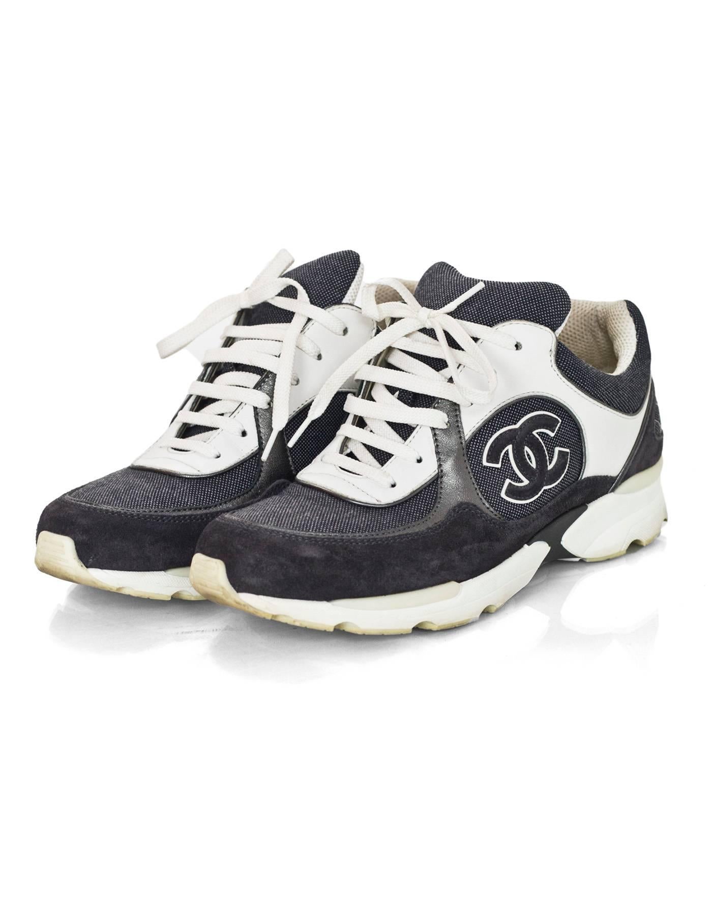 Chanel White and Grey CC Sneakers Sz 38.5 with Box

Made In: Italy
Color: White, grey
Materials: Leather, suede
Closure: Lace tie
Overall Condition: Light wear at insoles and outsoles, light surface marks and discoloration
Includes: Chanel box