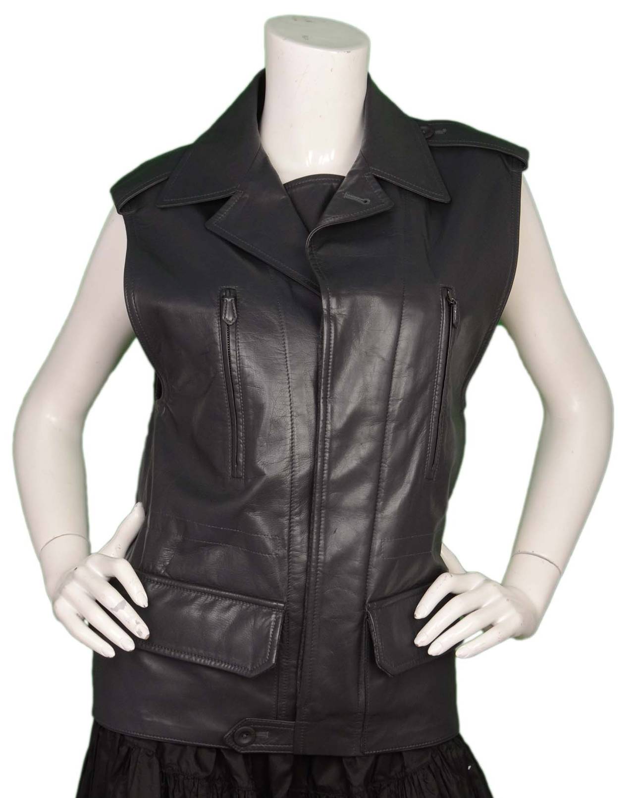 Reed Krakoff Grey Leather Vest Jacket sz Medium
Features interior tie and elastic band at back to create a form fitted look

    Made in: USA
    Color: Grey
    Composition: 100% calf leather
    Lining: Grey, 100% silk
    Closure/opening: