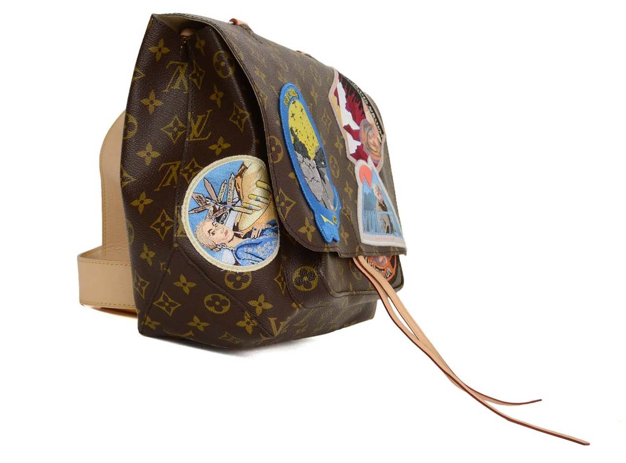 This limited edition bag was apart of Louis Vuitton's collaboration collection in late 2014. This particular bag was designed by Cindy Sherman. The bag features travel inspired patches throughout. Leather top handle and detachable adjustable