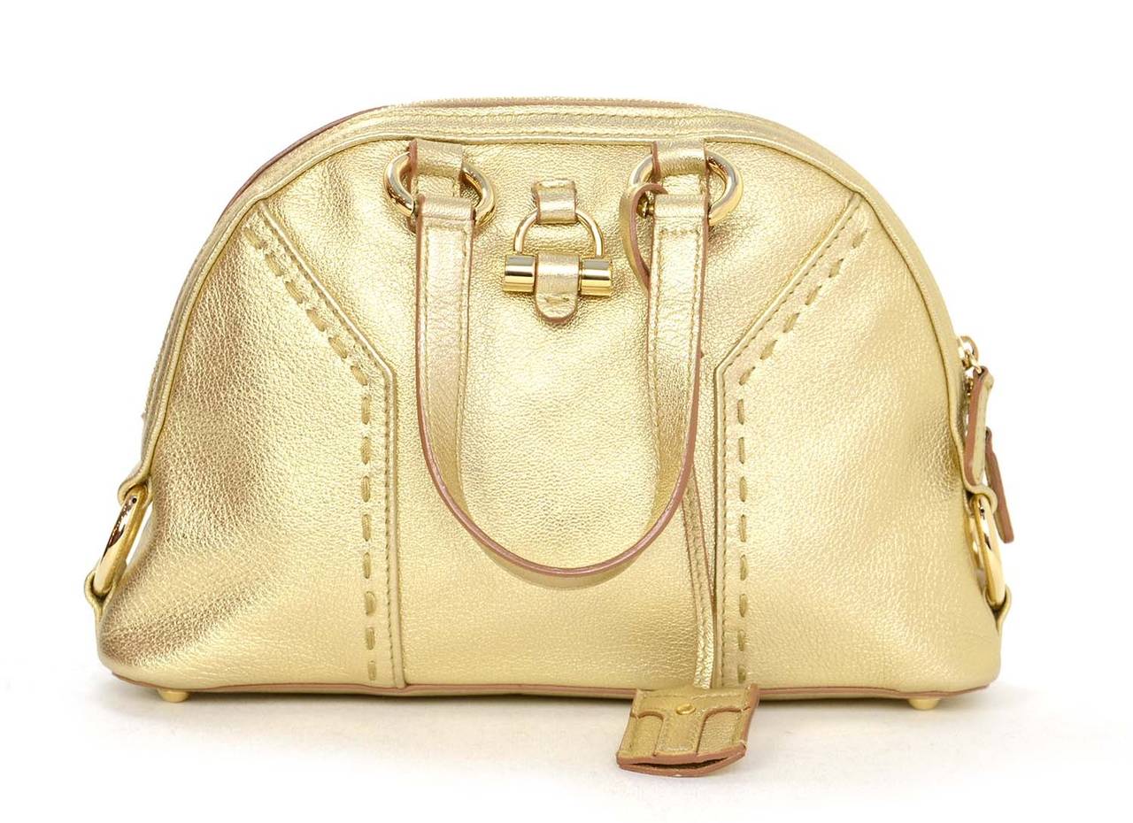 Yves Saint Laurent YSL '08 Gold Leather Micro Muse Bag
Features decorative clochette with gold hardware

    Made in: Italy
    Year of Production: 2008
    Color: Gold
    Hardware: Goldtone
    Materials: Leather and metal
    Lining: