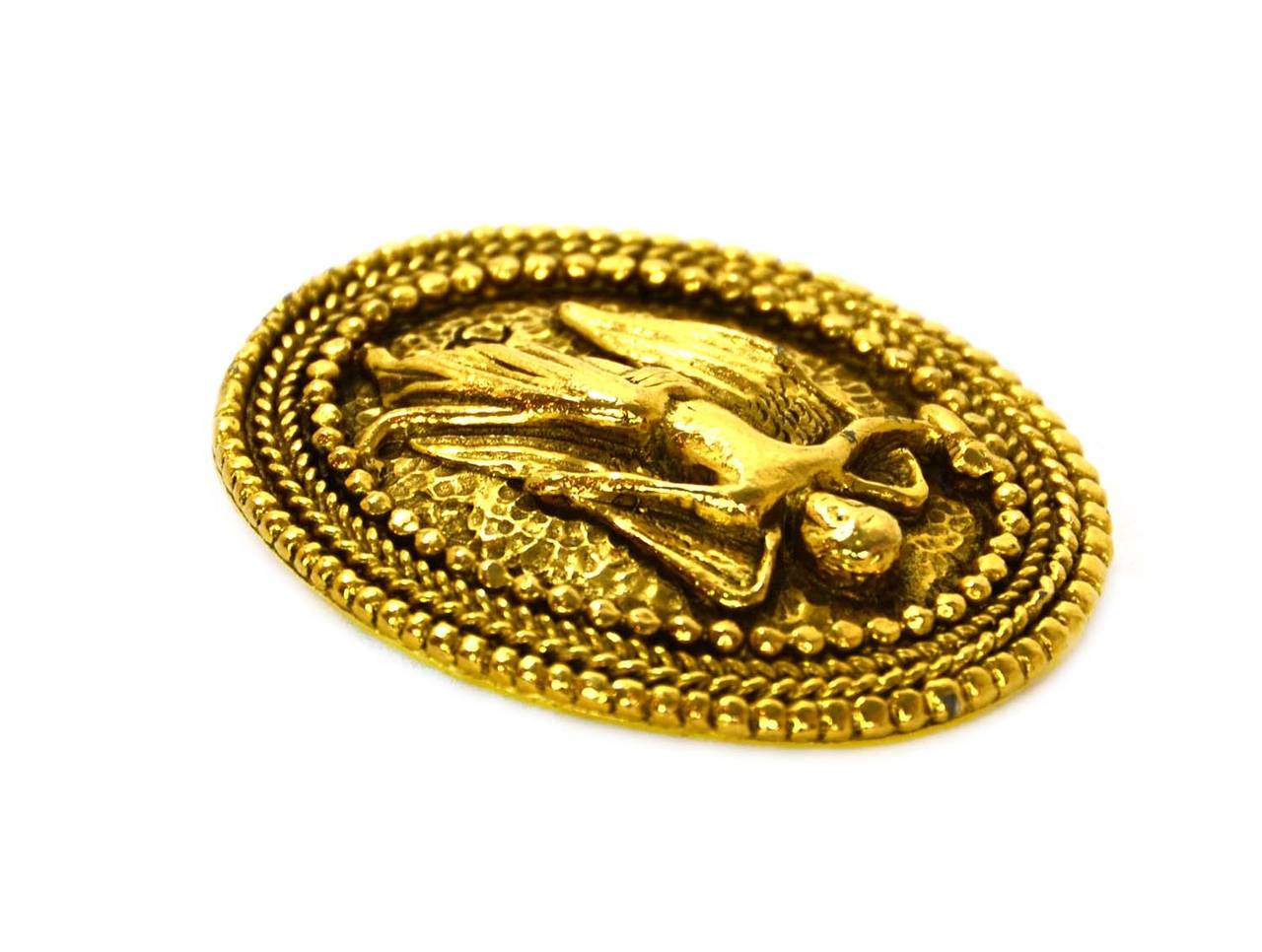 Chanel Vintage Gold Angel Brooch
Features intricate detailing framing angel

    Made in: France
    Year of Production: 1990-1992
    Stamp: CHANEL CC MADE IN FRANCE
    Closure: Pin back closure
    Color: Goldtone
    Materials: Metal
  