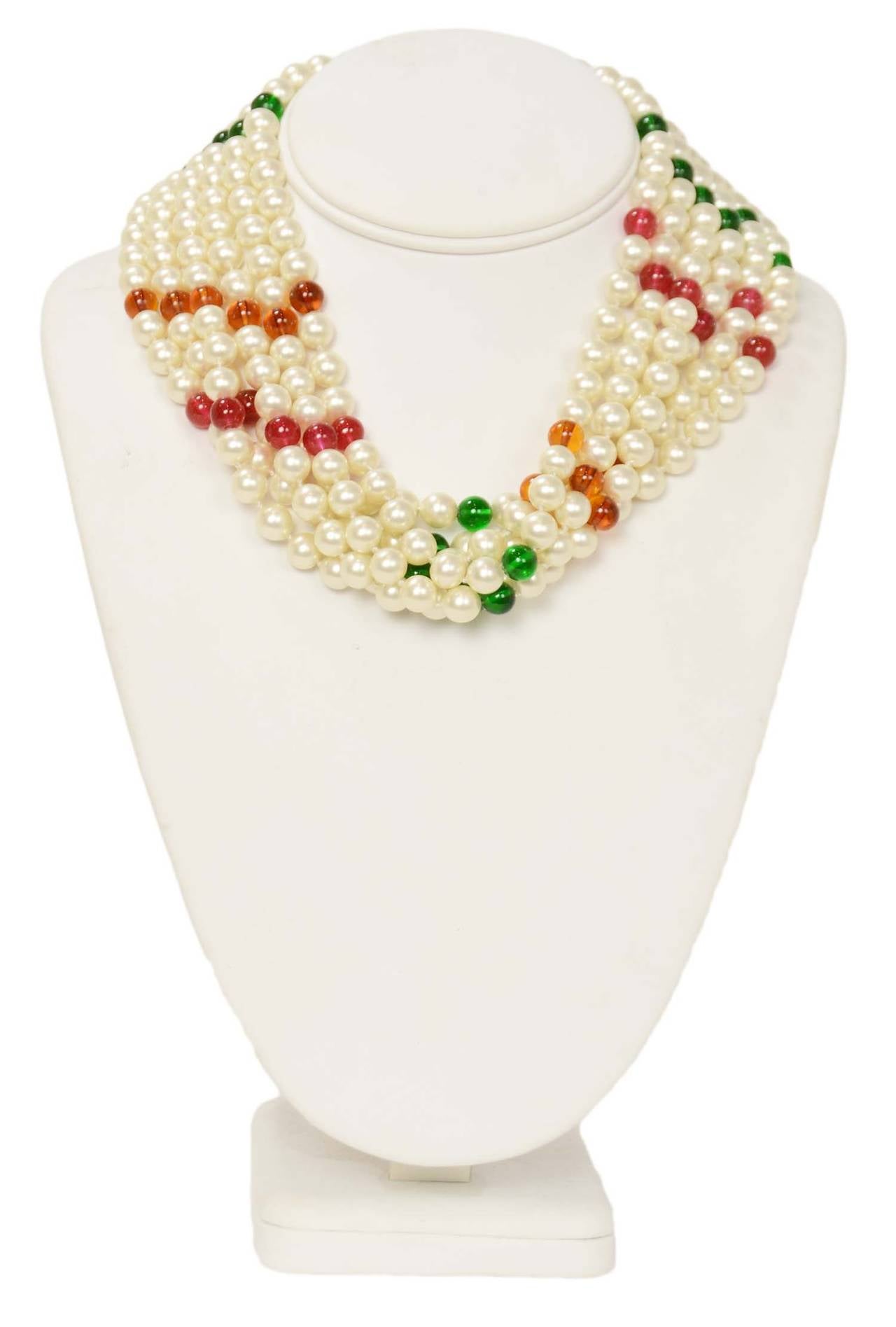 Chanel Vintage 70's-80's 6 Strand Pearl Necklace w/Gripoix Pendant
Features red,orange and green glass beads throughout

    Made in: France
    Year of Production: 1970's-1980's
    Stamp: CHANEL CC MADE IN FRANCE
    Closure: Hook and eye