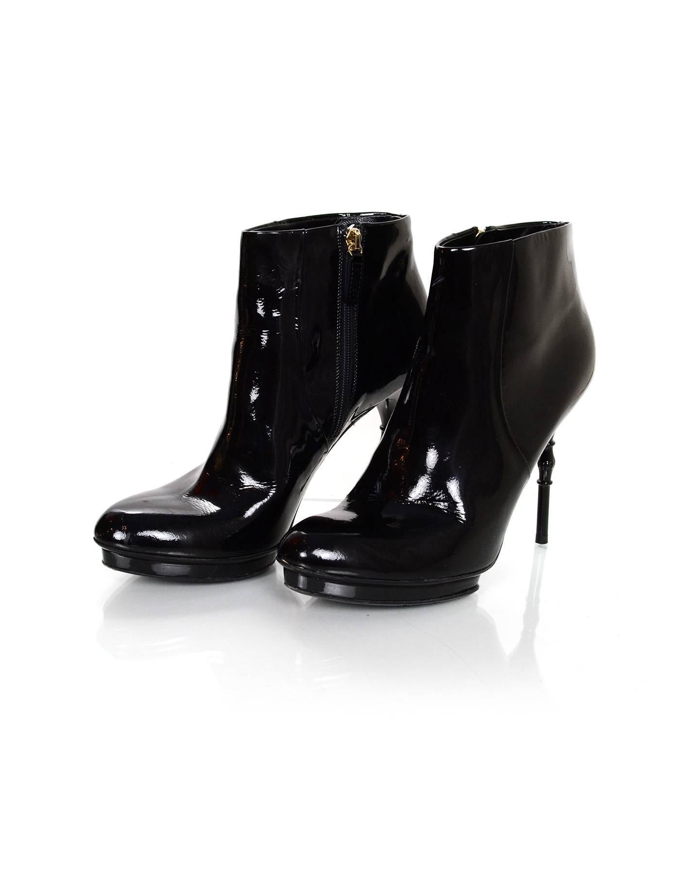 Gucci Black Patent Vitello Vernice Ankle Boots Sz 37

Made In: Italy
Color: Black
Materials: Patent leather
Closure/Opening: Zipper closure
Sole Stamp: Gucci Made in Italy 37
Overall Condition: Excellent pre-owned condition with the exception of
