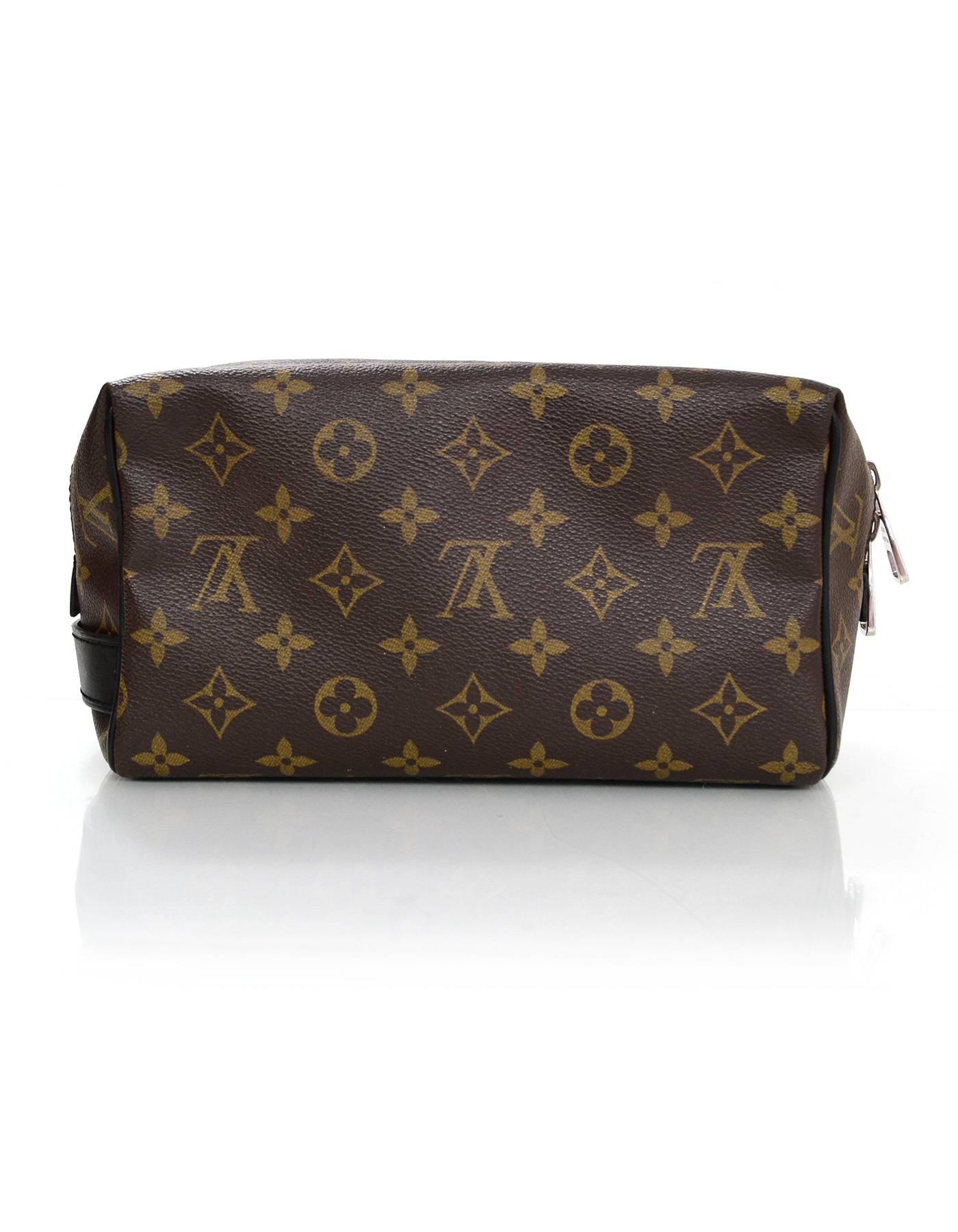Louis Vuitton Monogram Macassar Toiletry Kit

Made In: France
Year of Production: 2013
Color: Brown, pink
Hardware: Silvertone
Materials: Coated canvas, leather
Serial Number/Date Code: BA4113
Lining: Burgundy leather
Closure/Opening: Zip