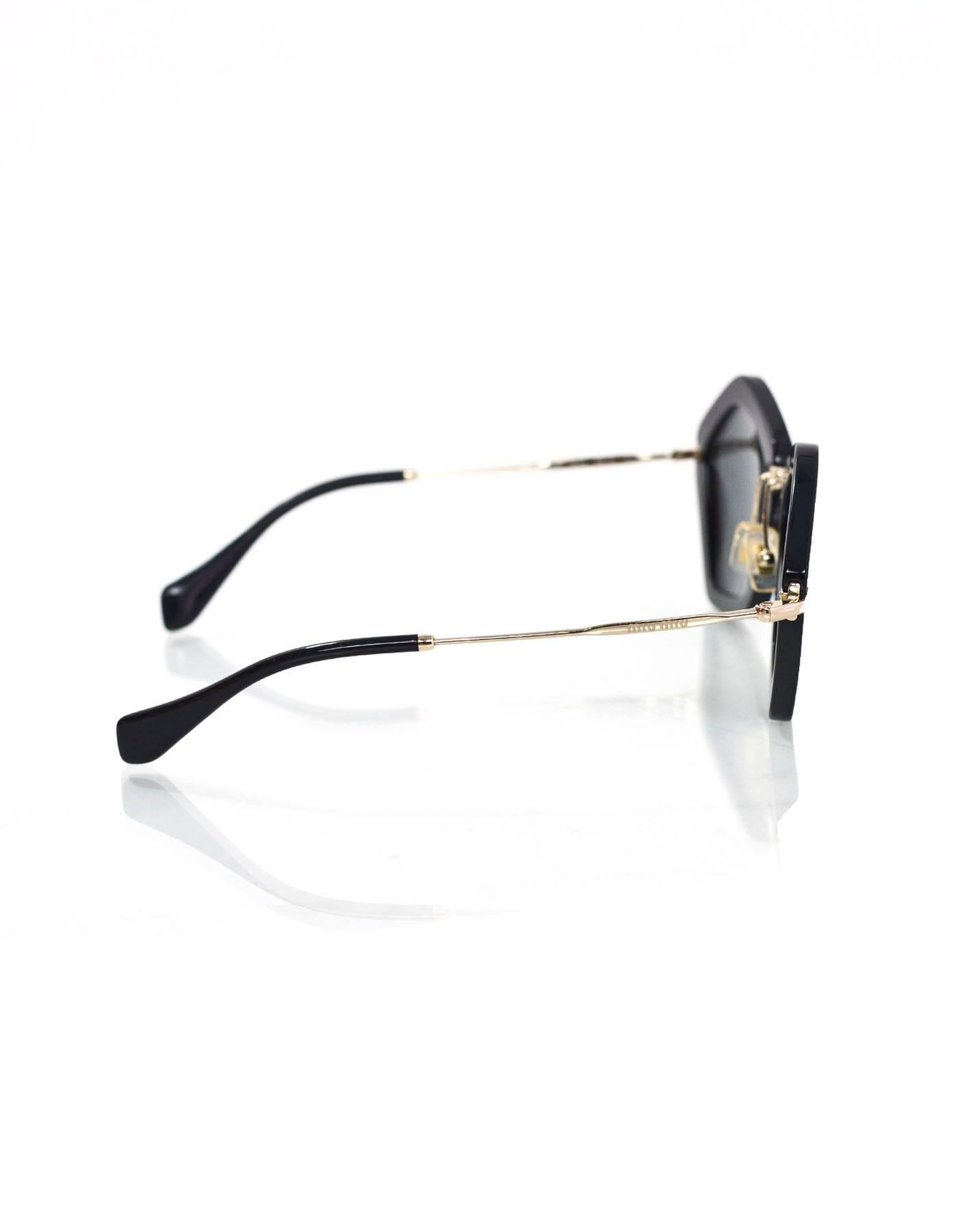 Miu Miu Black and Goldtone Noir Geometric Sunglasses

Made In: Italy
Color: Black, gold
Materials: Resin, metal
Retail Price: $430 + tax
Overall Condition: Excellent pre-owned condition with the exception of minor surface marks
Includes: Miu Miu