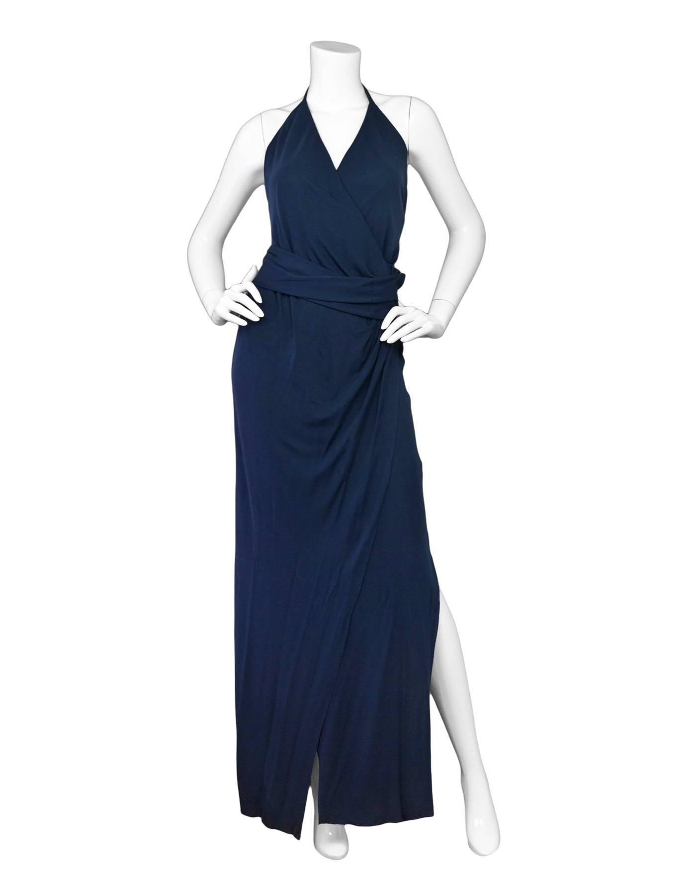 L'Agence Navy Sabrina Wrap-Effect Halter Neck Gown 
Features wrap at waist with snaps at hip

Made In: China
Color: Navy
Composition: 100% viscose
Lining: None
Closure/Opening: Back zip up
Exterior Pockets: None
Interior Pockets: None
Retail Price: