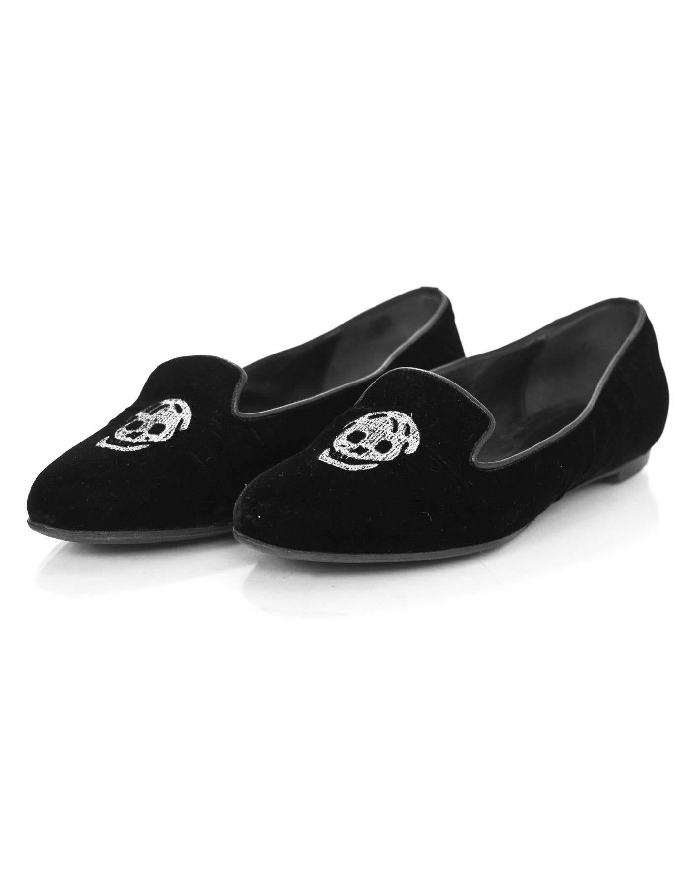 Alexander McQueen Black Velvet Skull Loafers Sz 35.5

Made In: Italy
Color: Black
Materials: Velvet
Closure/Opening: Slide on
Sole Stamp: CQ vero cuoio made in italy 35.5
Retail Price: $825 + tax
Overall Condition: Very good pre-owned condition with