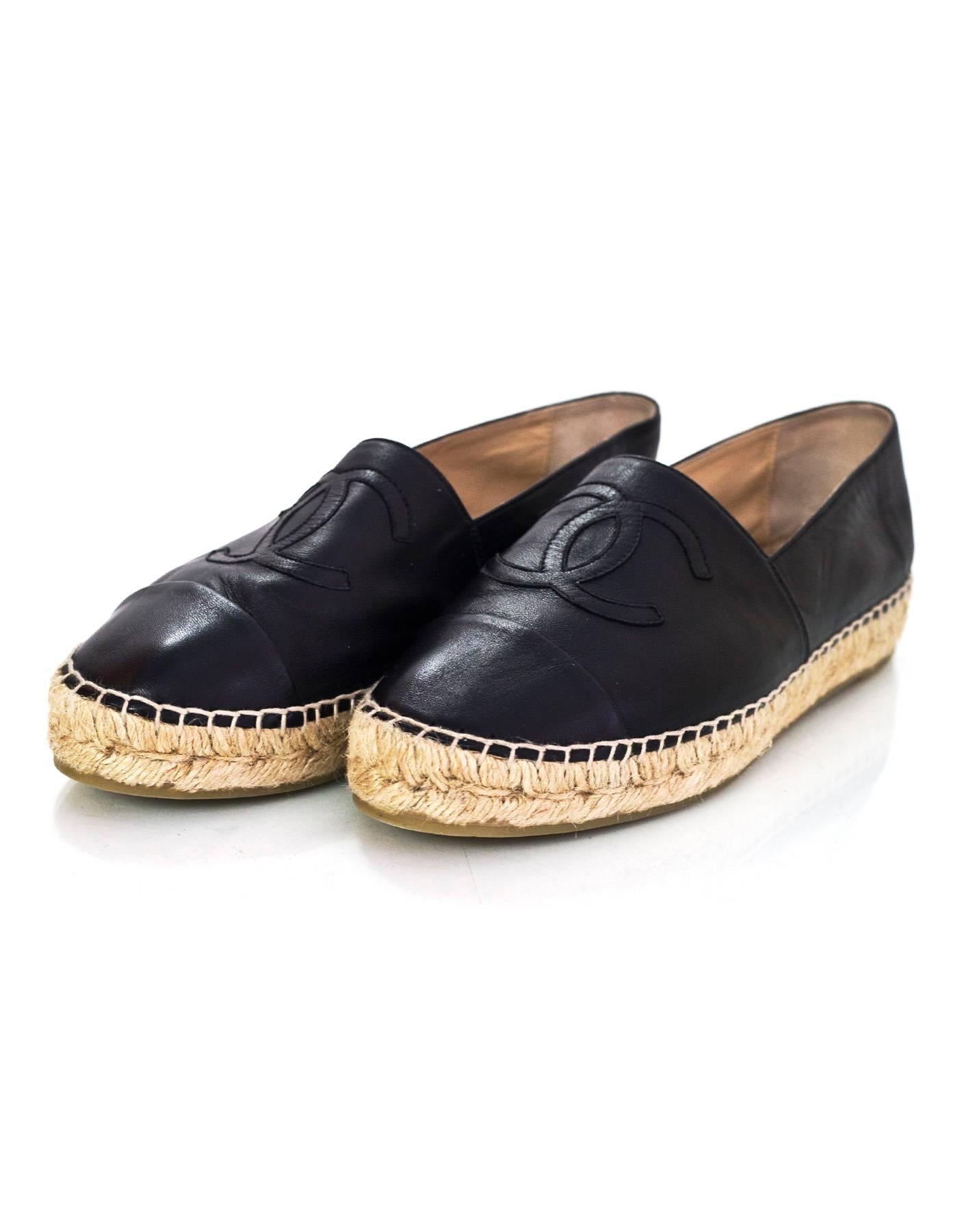 Chanel Black Leather Espadrilles Sz 37

Made In: Spain
Year Of Production: 2016
Color: Black
Materials: Leather, jute rope
Closure/Opening: Slide on
Sole Stamp: Made in Spain 37 Chanel CC
Overall Condition: Excellent pre-owned condition with the