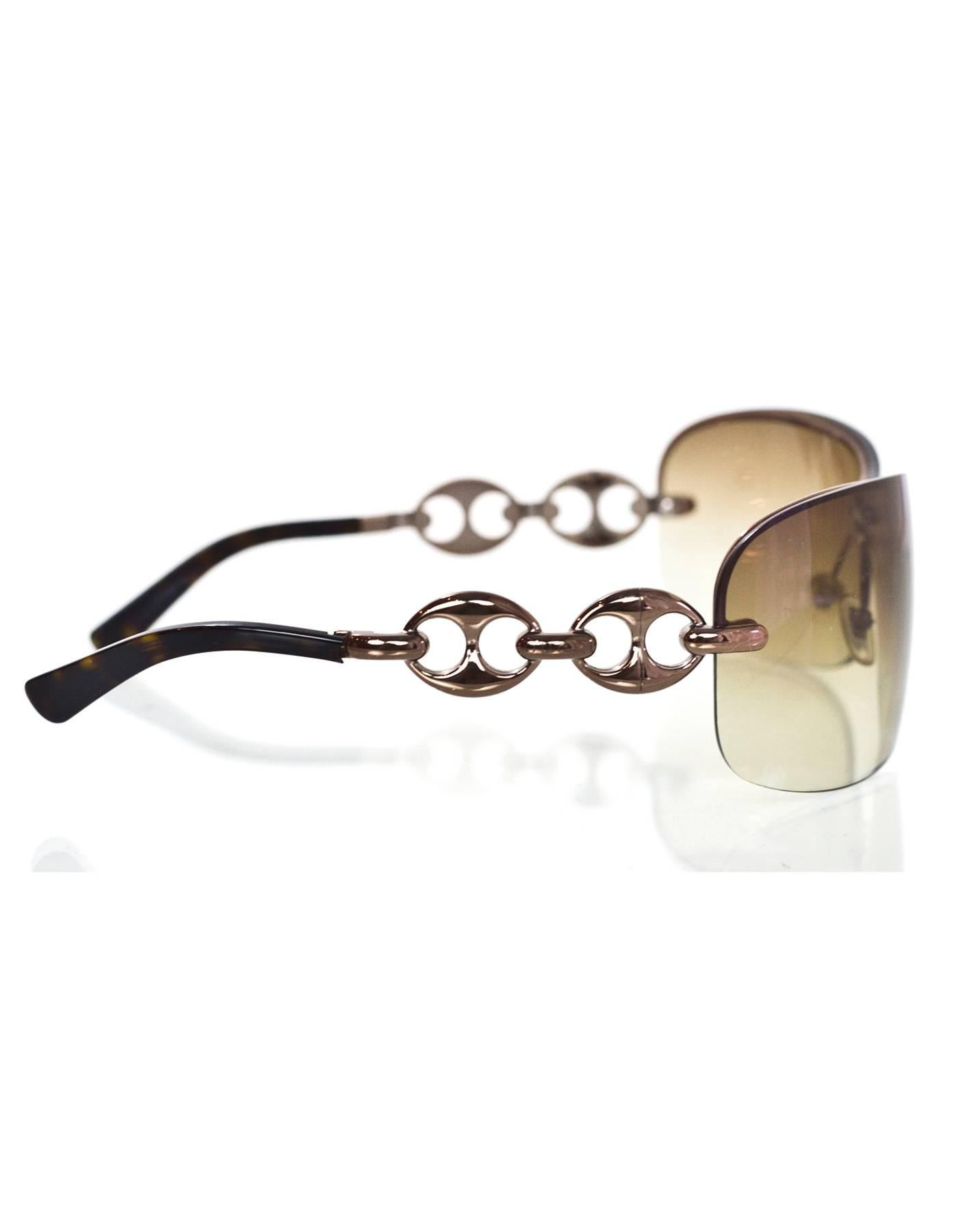 Gucci Brown Shield Sunglasses
Features horsebit arms

Made In: Italy
Color: Brown
Materials: Metal
Overall Condition: Excellent pre-owned condition with the exception of bent arms, surface marks at frame
Includes: Gucci case and