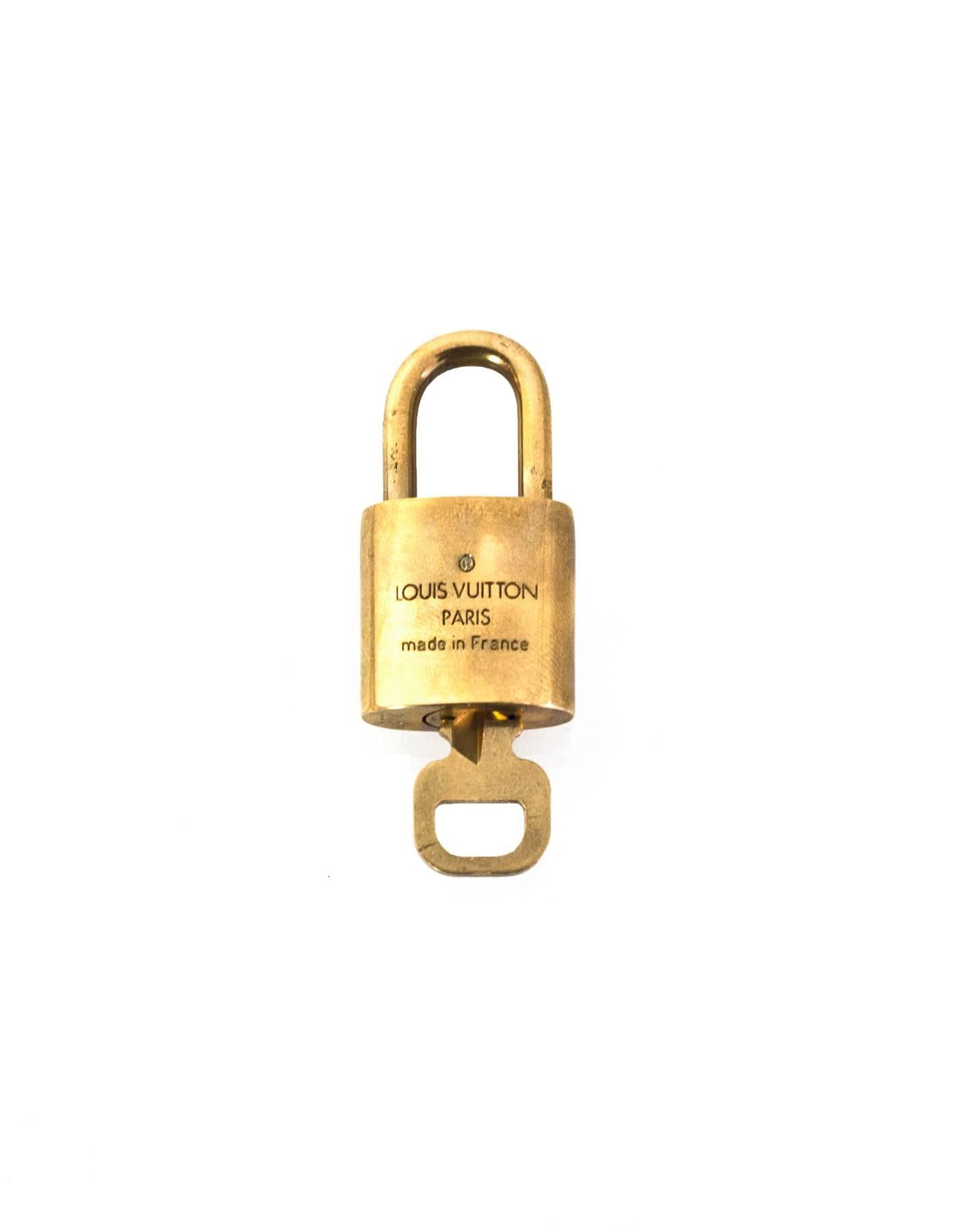 Louis Vuitton Goldtone Lock & Key

Made In: France
Color: Gold
Hardware: Goldtone
Materials: Metal
Stamp: Louis Vuitton Made in France 302
Overall Condition: Very good good pre-owned condition, light tarnish throughout
Includes: Lock, one