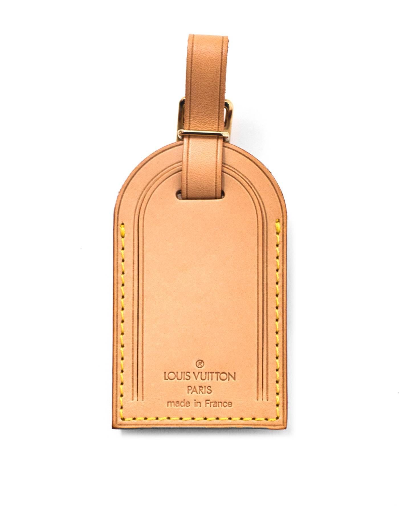 Louis Vuitton Vachetta Luggage Tag & Loop

Made In: France
Color: tan
Hardware: Goldtone
Materials: Vachetta leather
Closure/Opening: Buckle closure
Overall Condition: Excellent pre-owned condition - NEW
Includes: Louis Vuitton dust